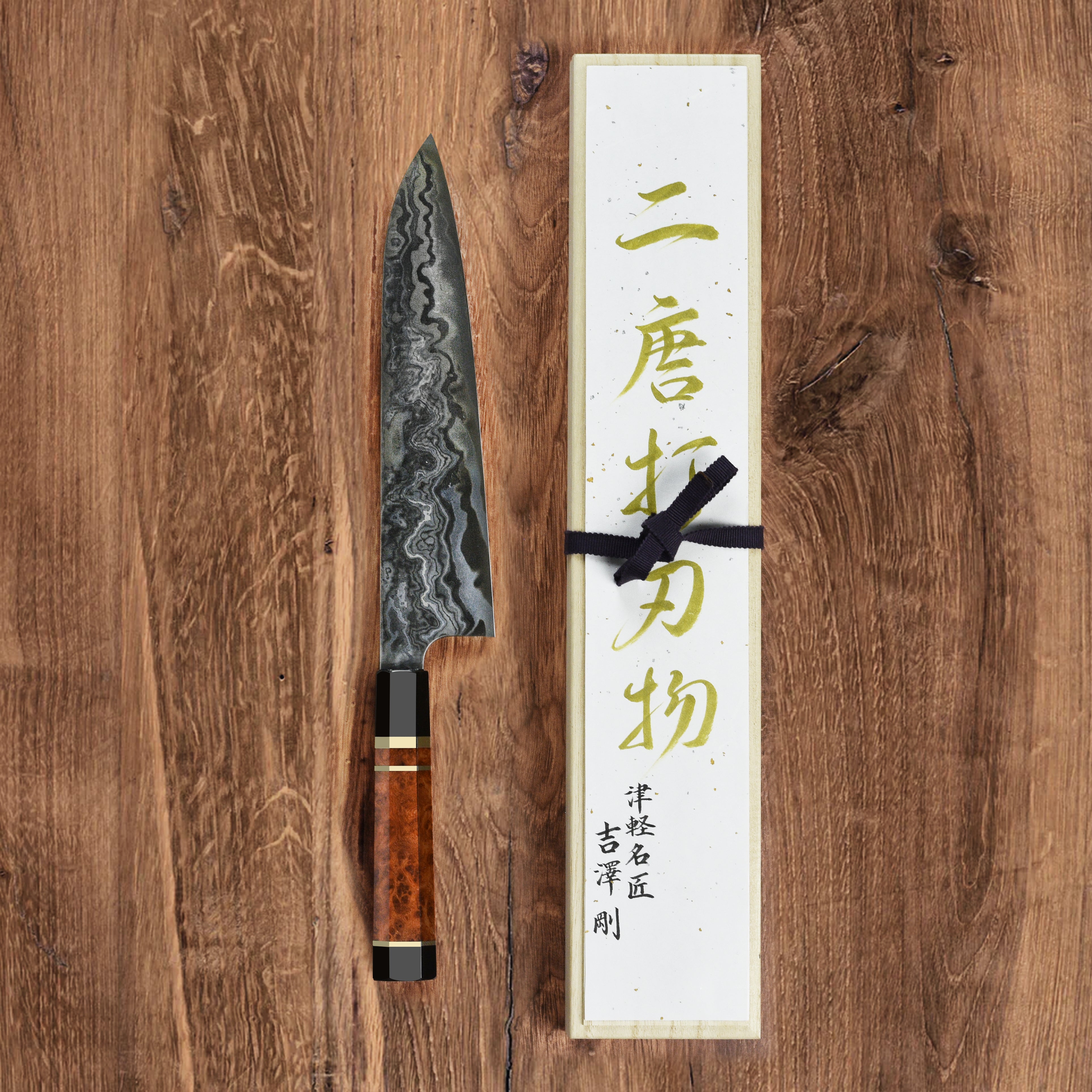 Handle and spine detail of the coreless Damascus Gyuto, highlighting craftsmanship and balance