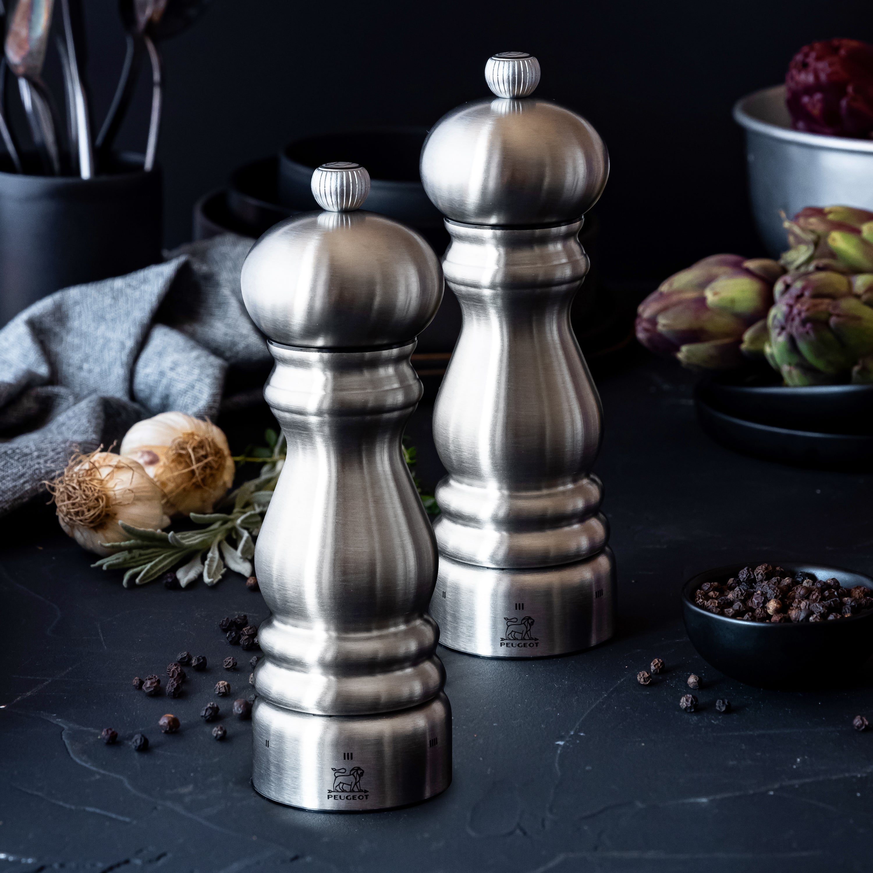 Peugeot Paris stainless steel pepper mill highlighting its grinding mechanism.