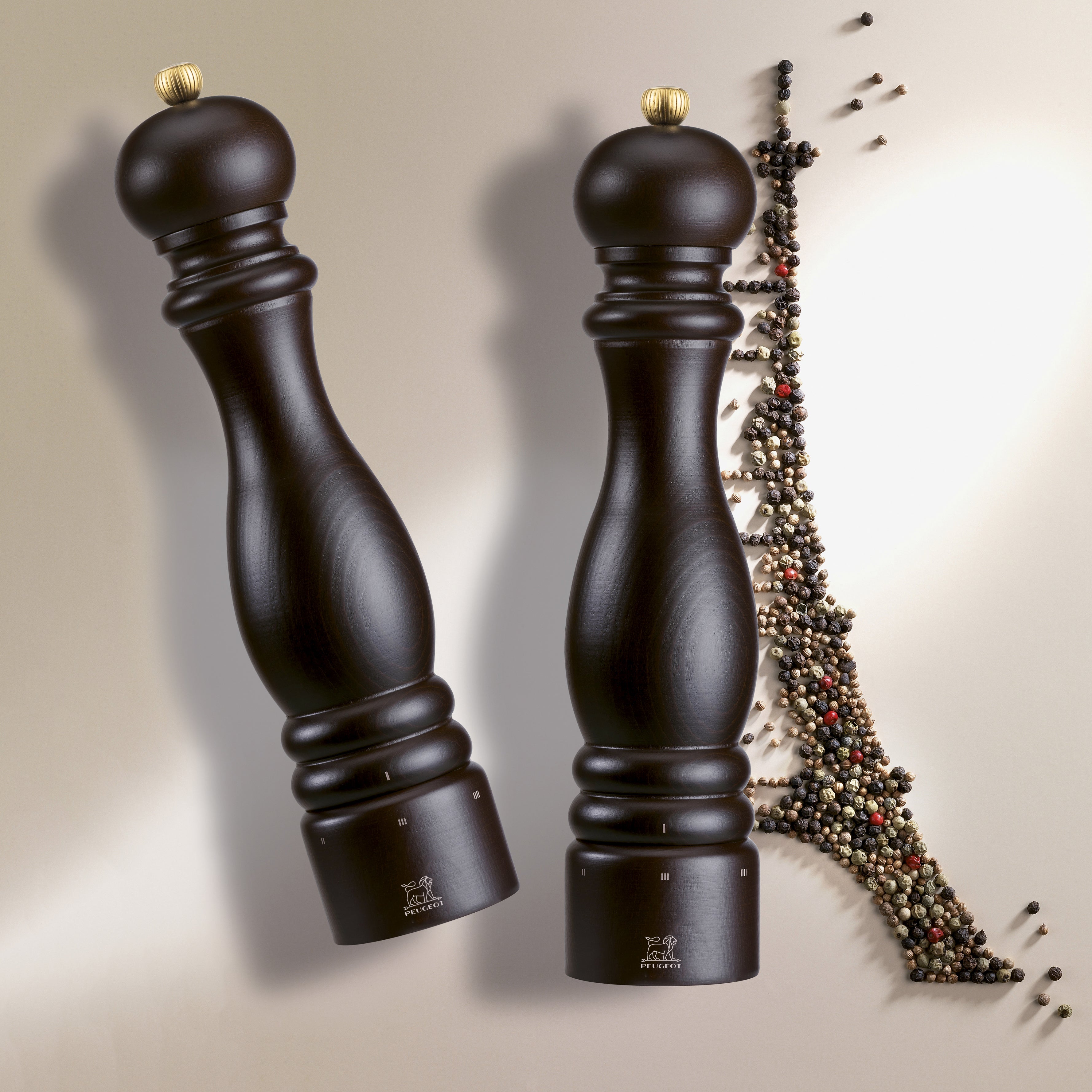 Peugeot Paris Chocolate Salt and Pepper Mill Set from a side angle, highlighting the sleek beechwood finish.