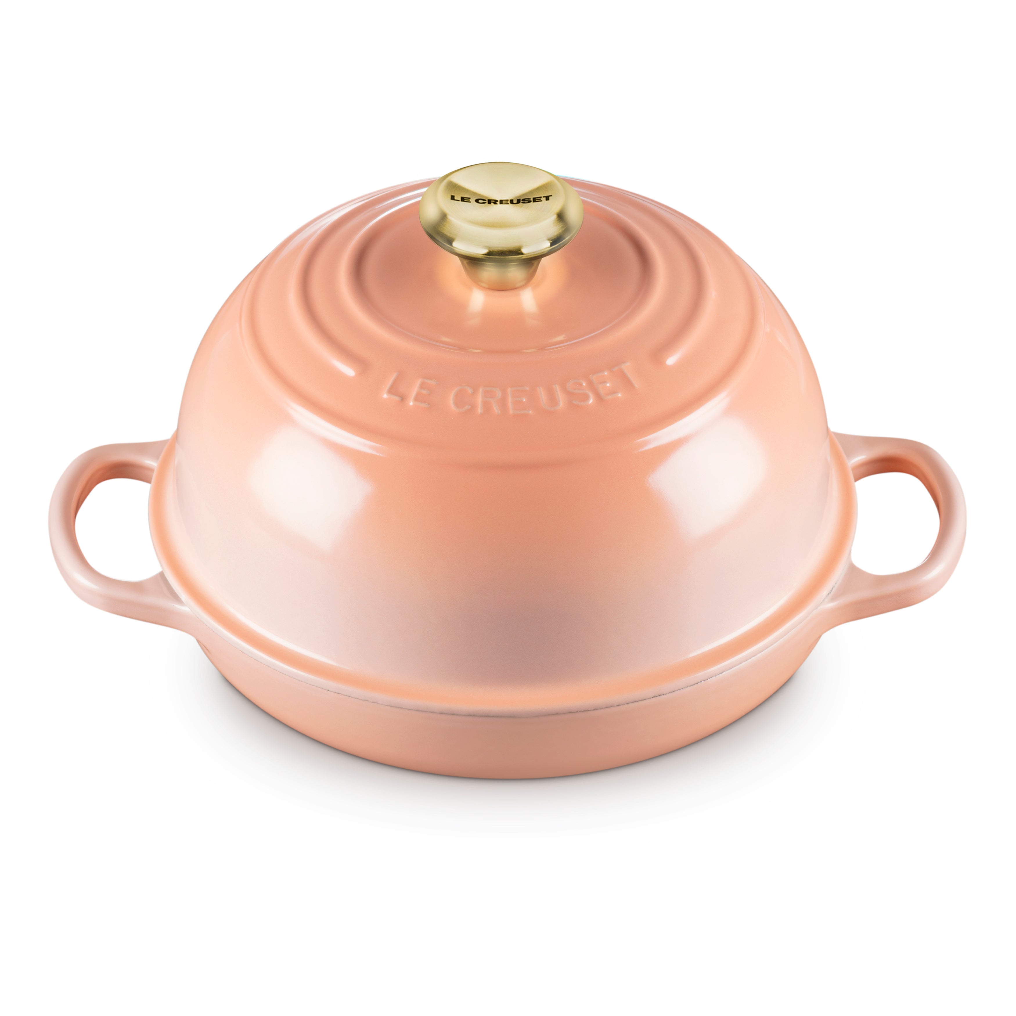 Le Creuset cast iron bread oven with lid on a kitchen counter, ideal for bread baking