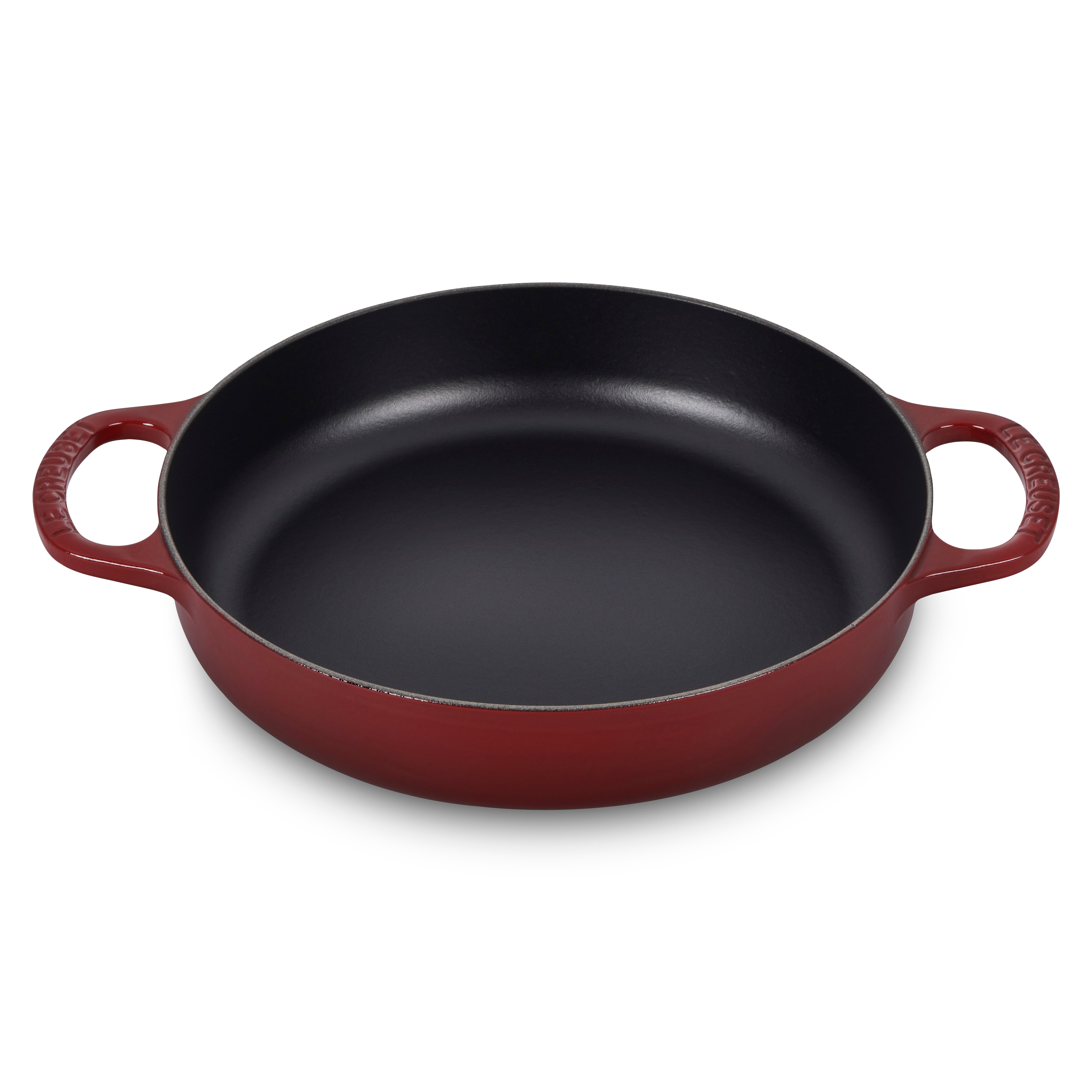 Le Creuset Rhone pan from above, highlighting its enameled finish and curved sides.