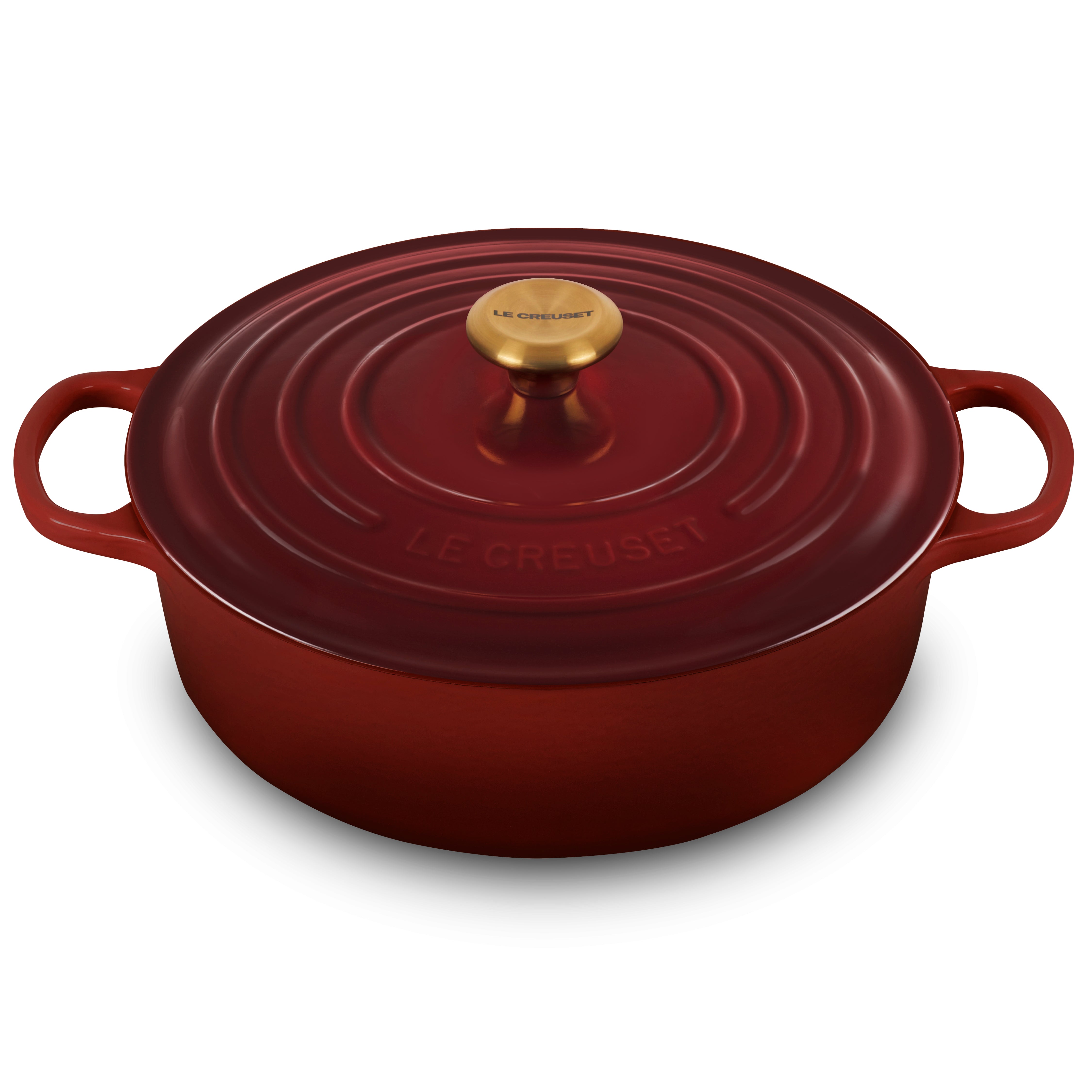 Le Creuset 6.75-quart enameled cast iron Dutch oven with gold knob on stovetop