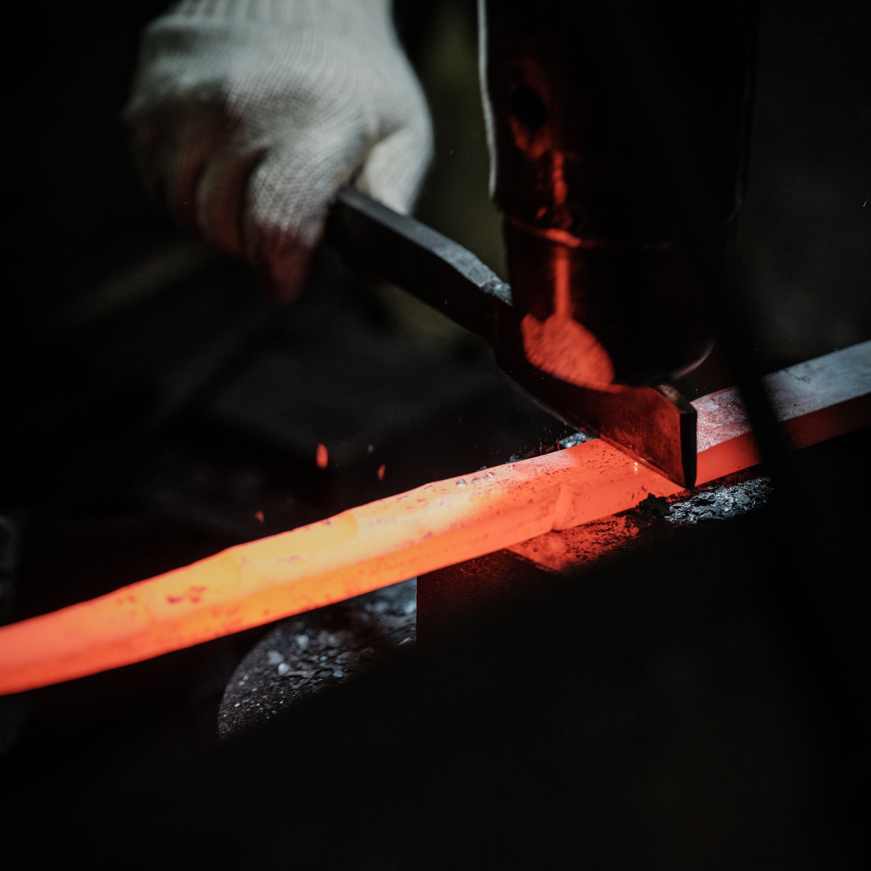 Sakai Mastercraft petty knife in action, slicing fresh vegetables on a cutting board.