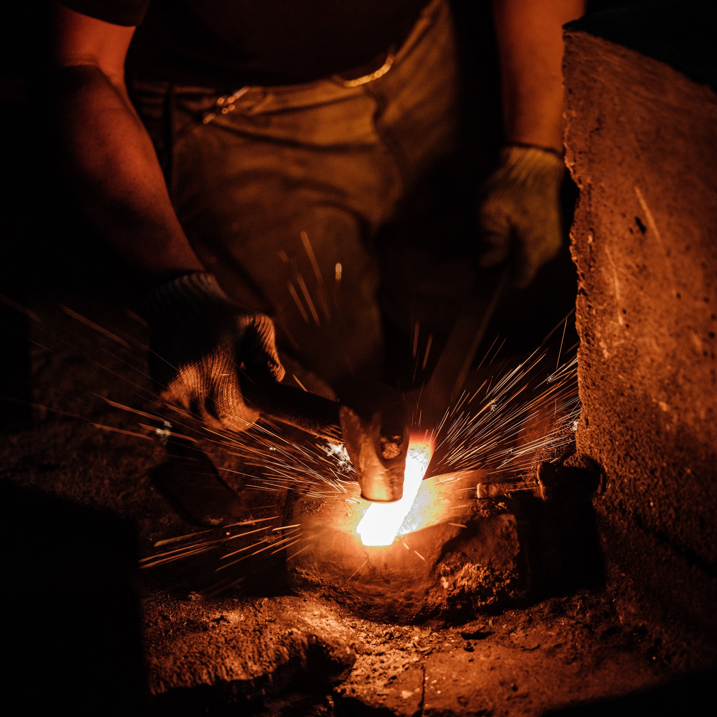 Close-up of the hand-forged blade with water buffalo horn ferrule highlighting craftsmanship detail.