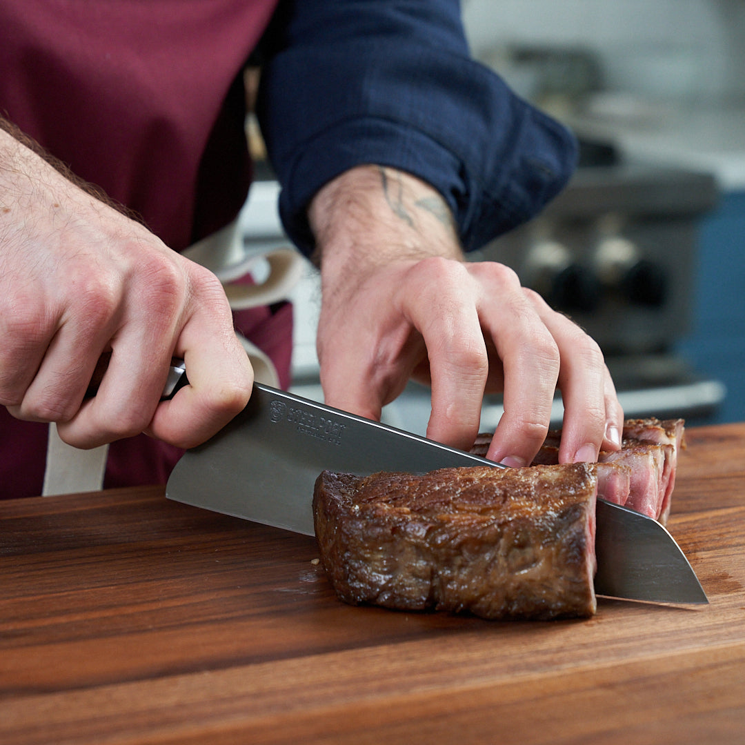 Close-up of the sharp blade of a carbon steel chef knife for precision slicing