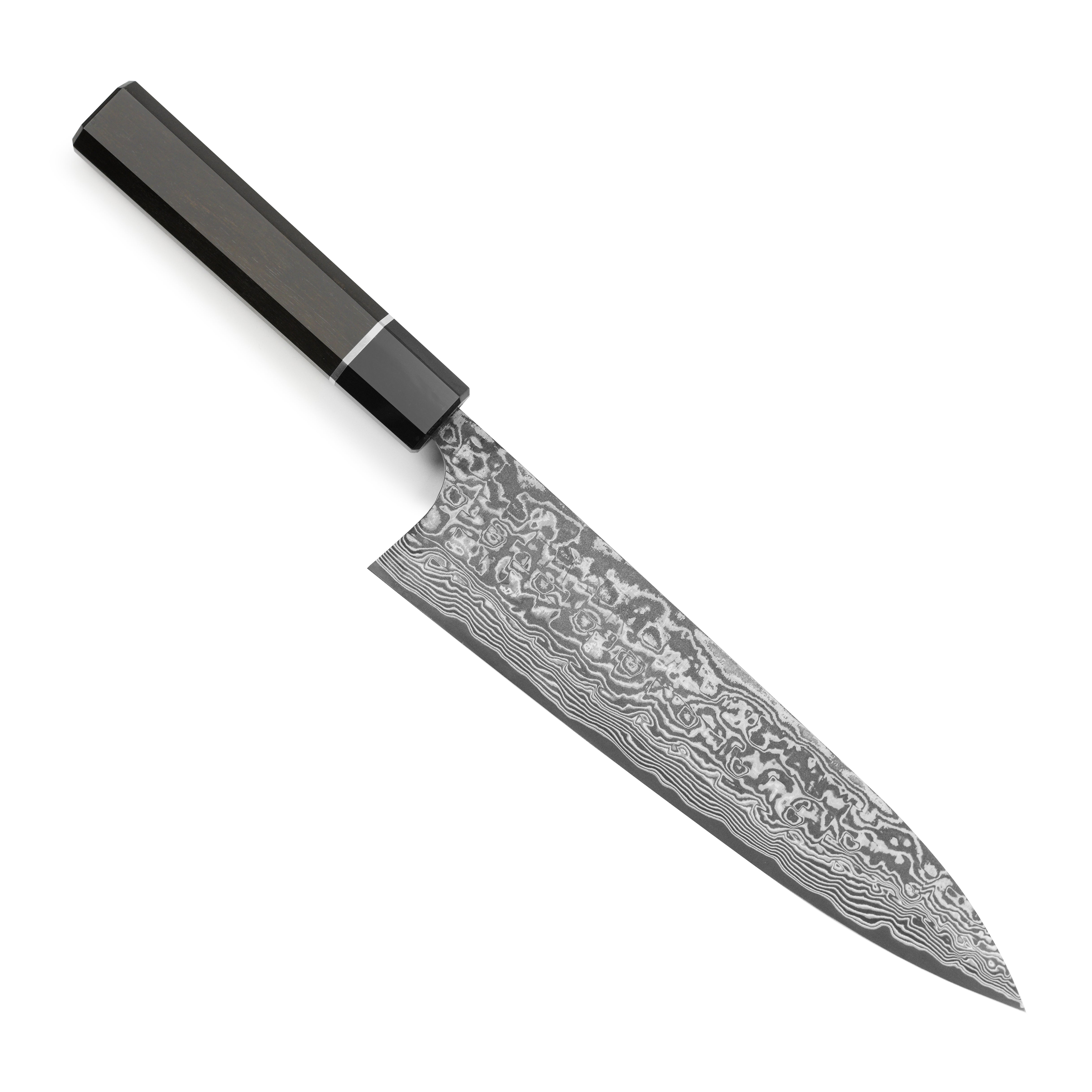 Close-up of the SG2 steel knife blade revealing intricate Damascus patterns and the sharp edge.