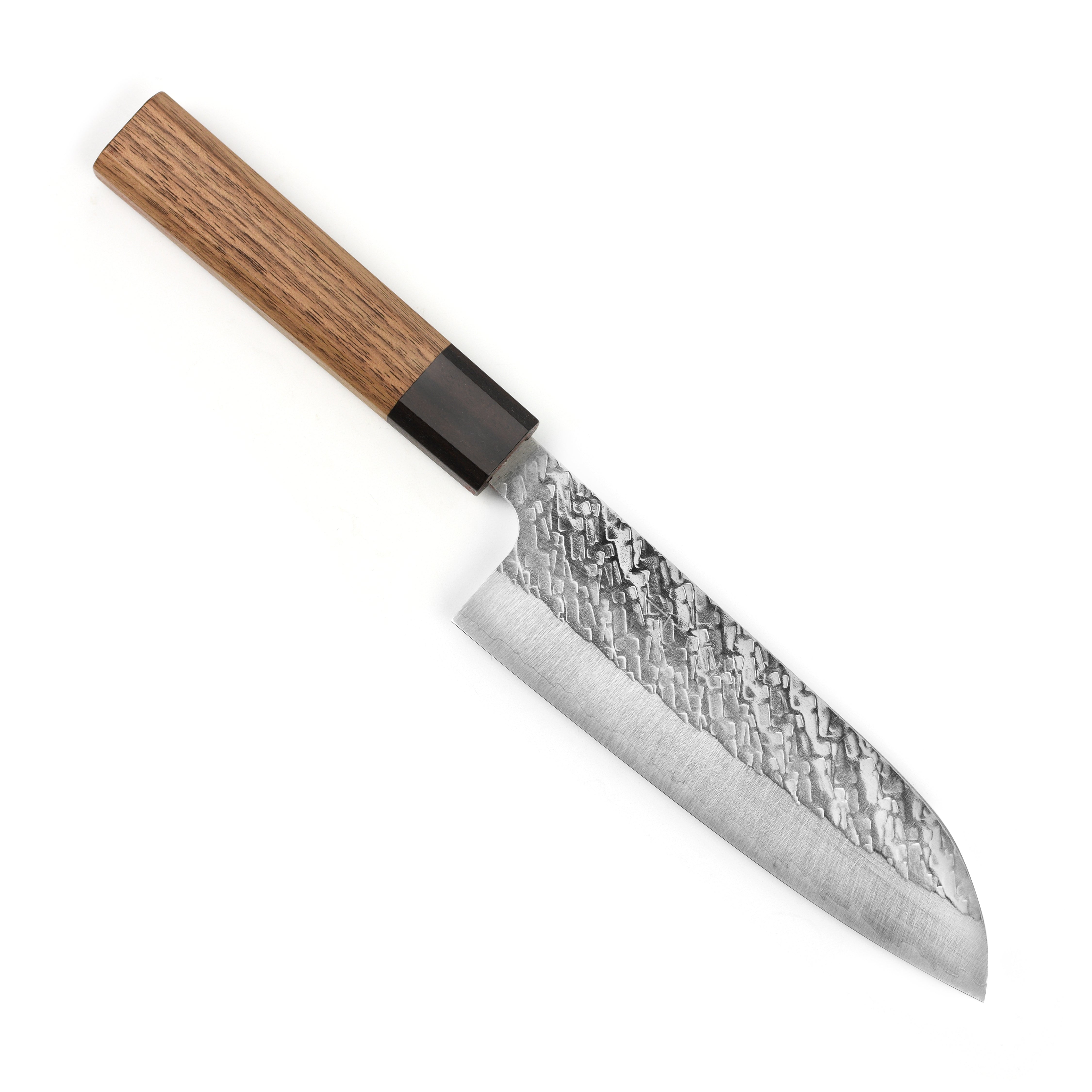 Chef slicing vegetables using the premium Japanese santoku knife from Takeshi Saji