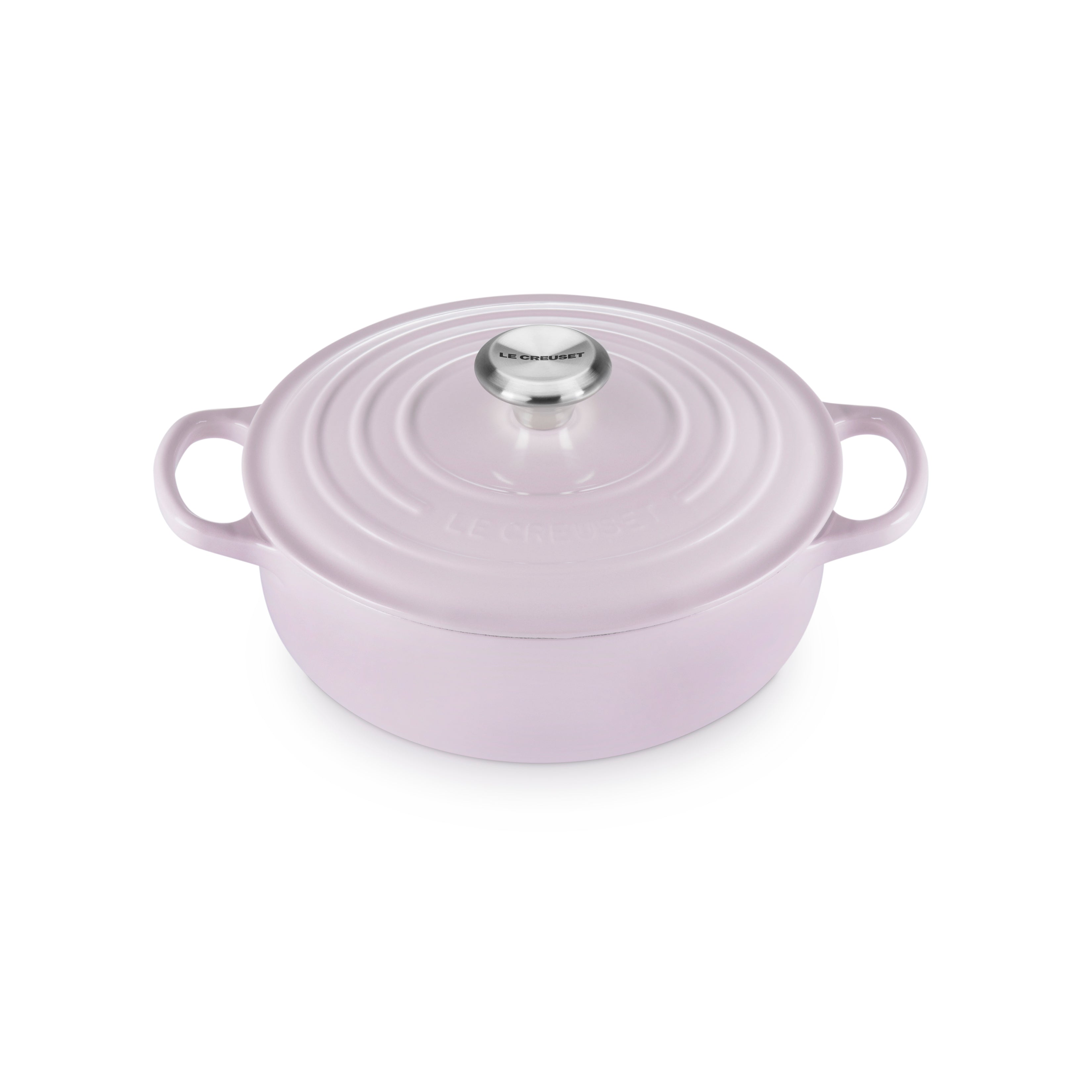 Le Creuset enamel cast iron Dutch oven in shallot color with lid closed, perfect for stovetop cooking.