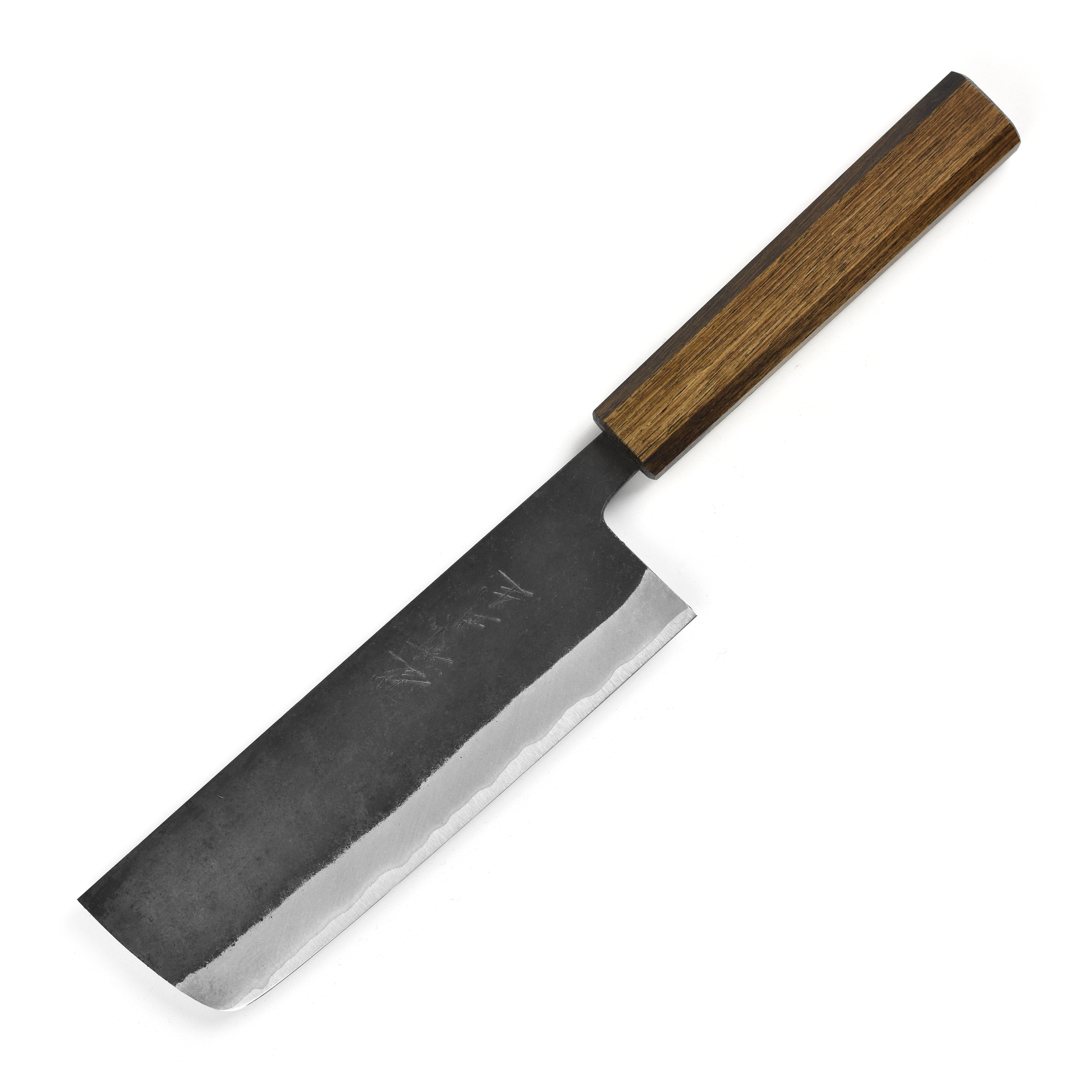 Chef slicing vegetables with the Japanese Nakiri knife in a contemporary kitchen