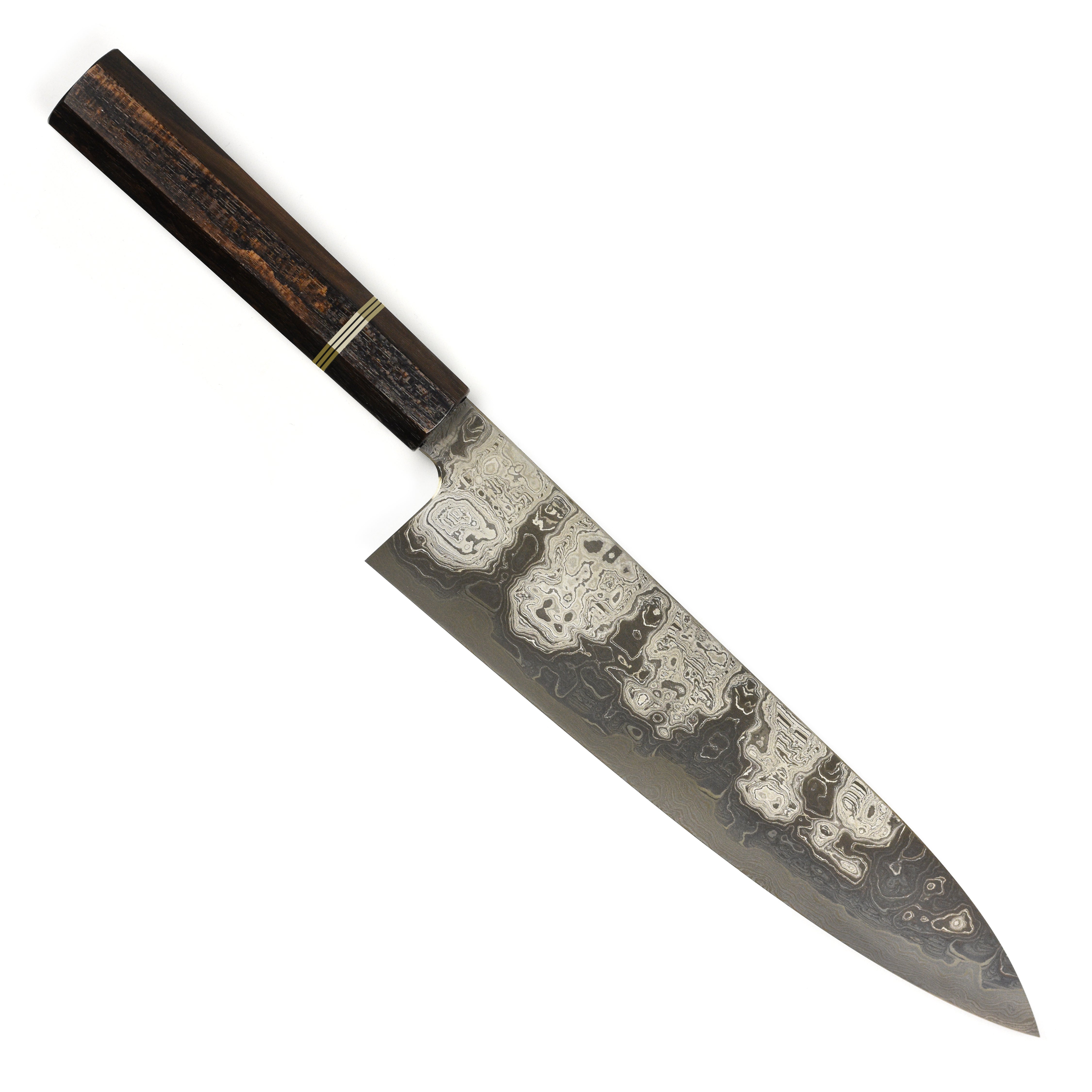 Close-up of the Shiomachi Aogami Gyuto knife cutting fresh vegetables, highlighting its sharp edge and craftsmanship.