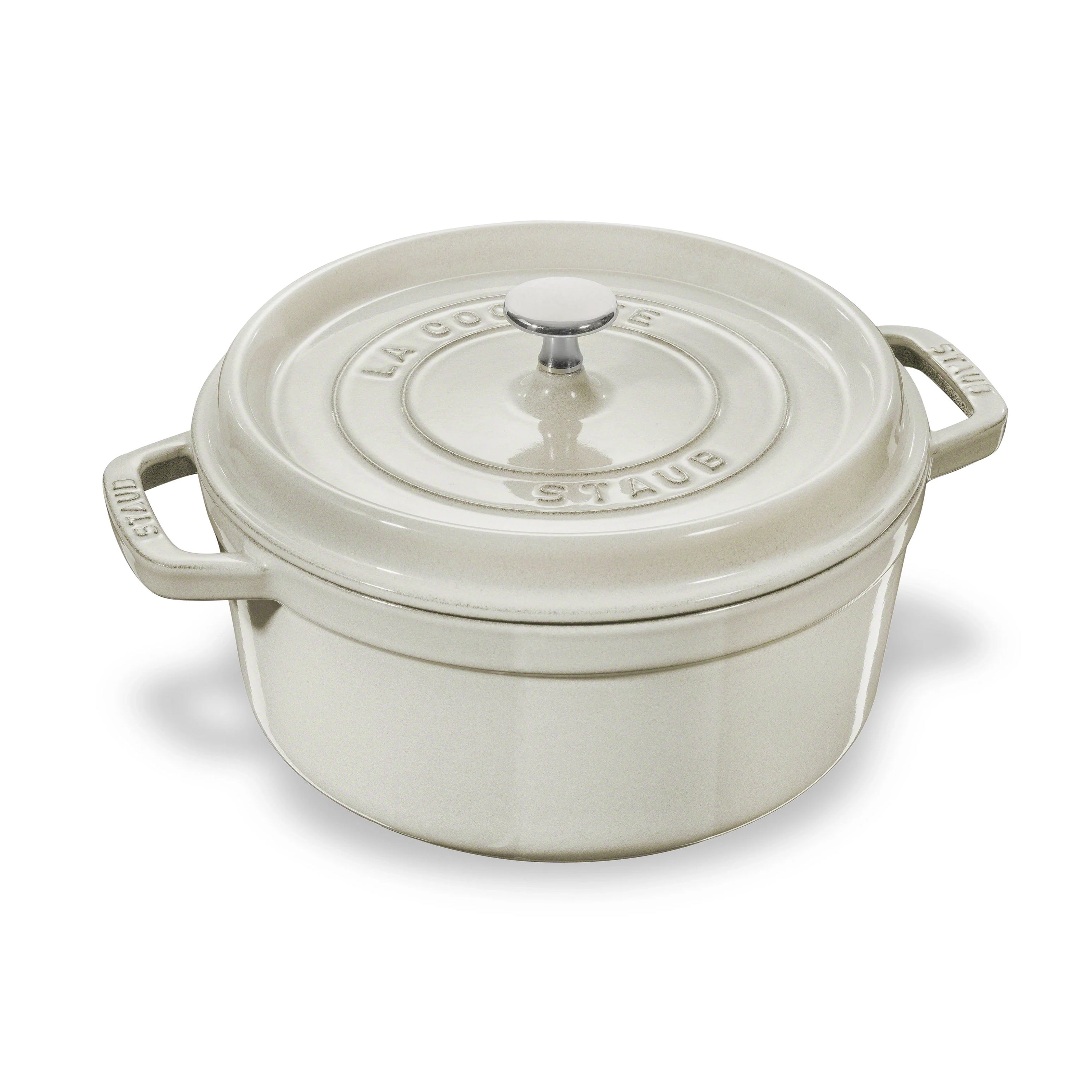 Staub 5.5-quart Dutch oven with lid showcasing its elegant White Truffle finish and design features.