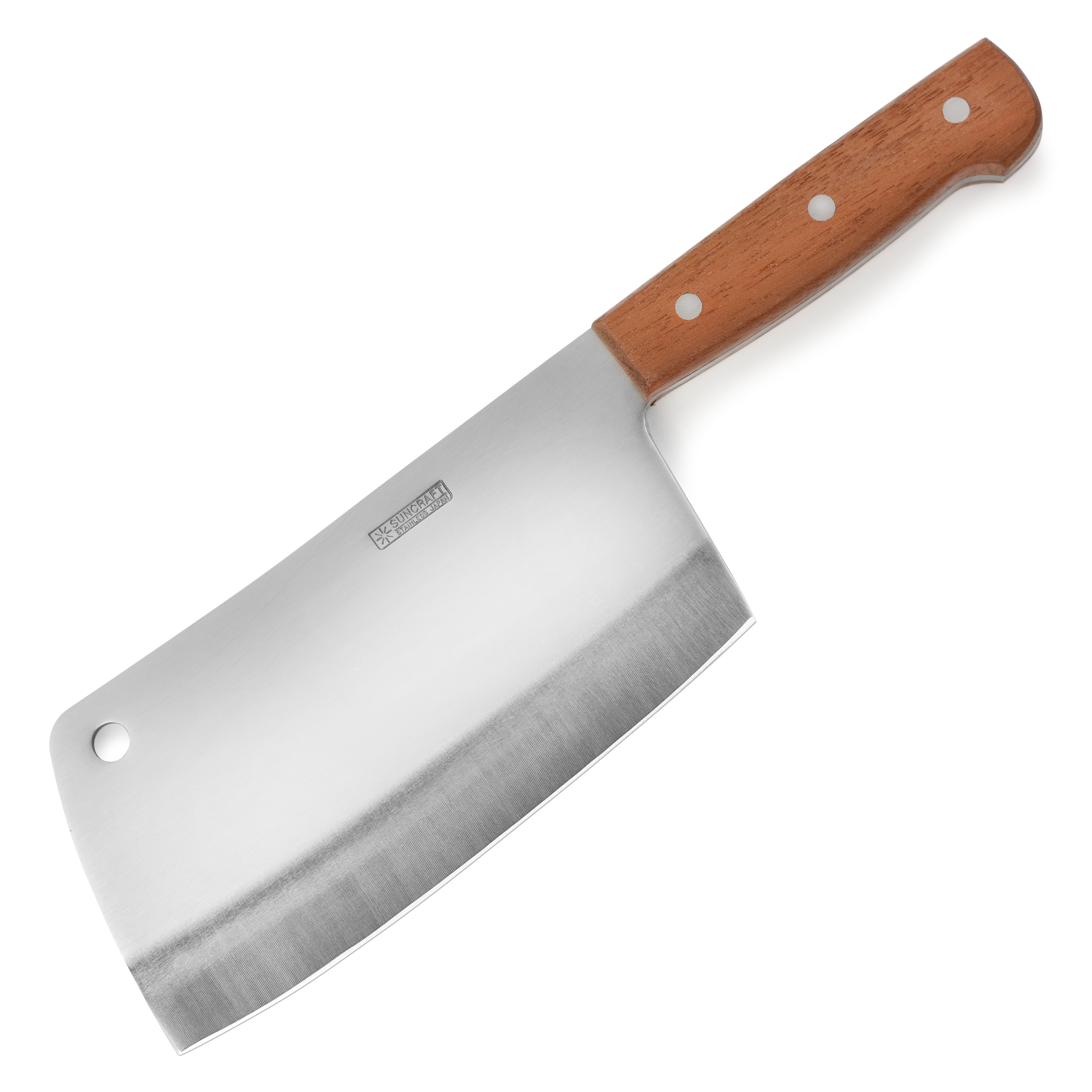 Suncraft meat cleaver in action, chopping vegetables on a wooden cutting board.