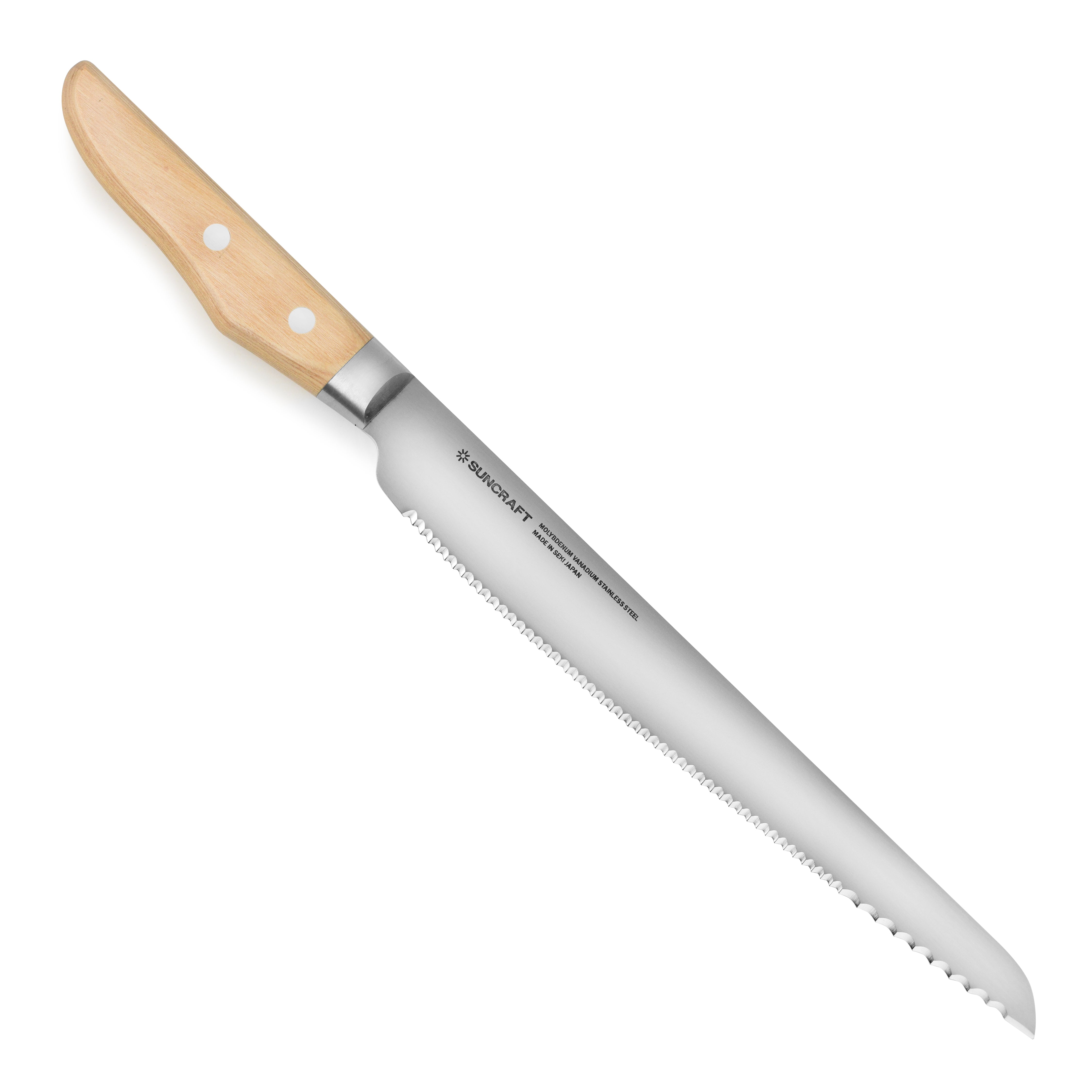 Close-up of the Suncraft Seseragi bread knife slicing through a crusty loaf of bread.