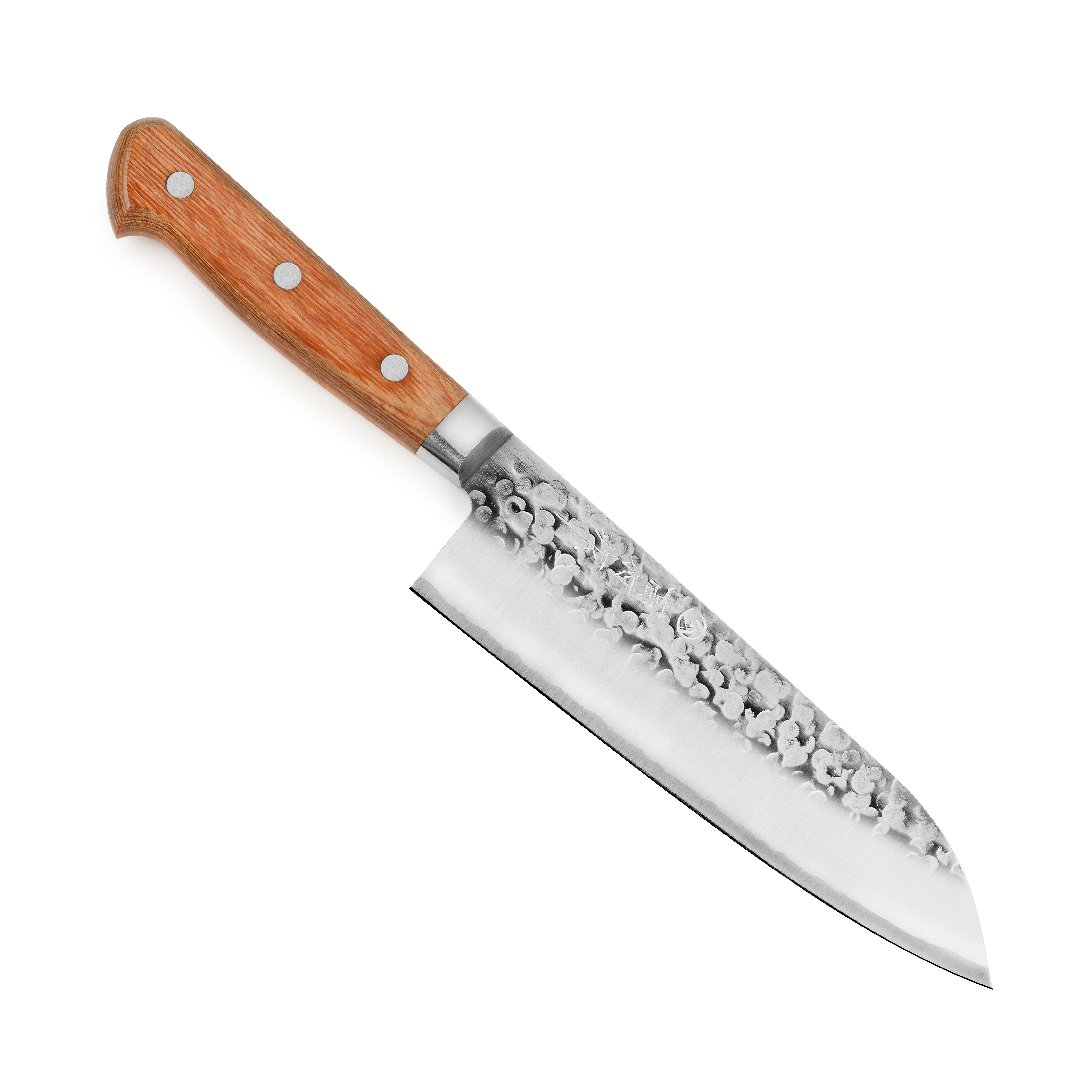 Chef slicing vegetables with Takamura Chromax Tsuchime Santoku in a modern kitchen setting
