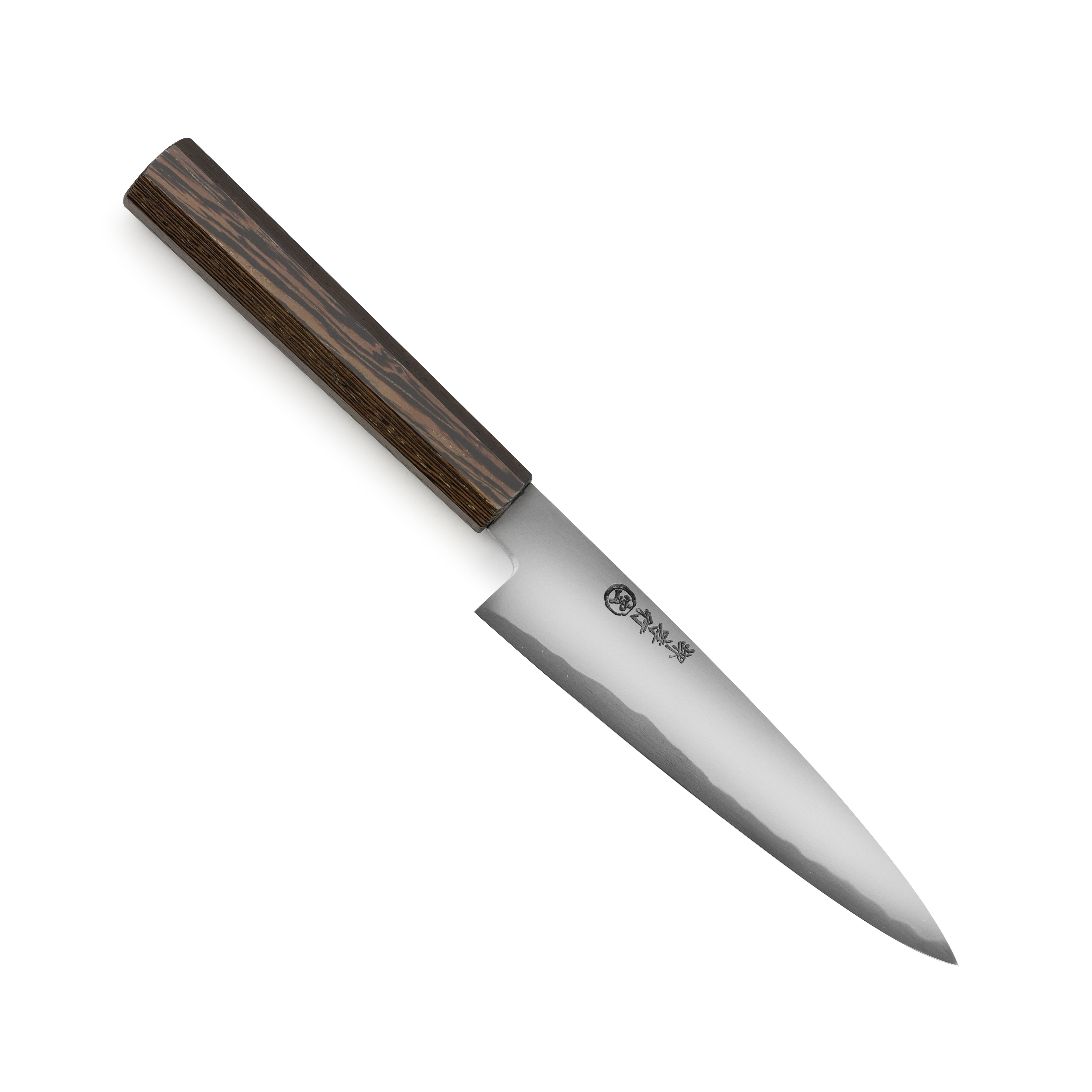 Takayuki hand-forged petty knife on a wooden cutting board, ideal for precision cutting.