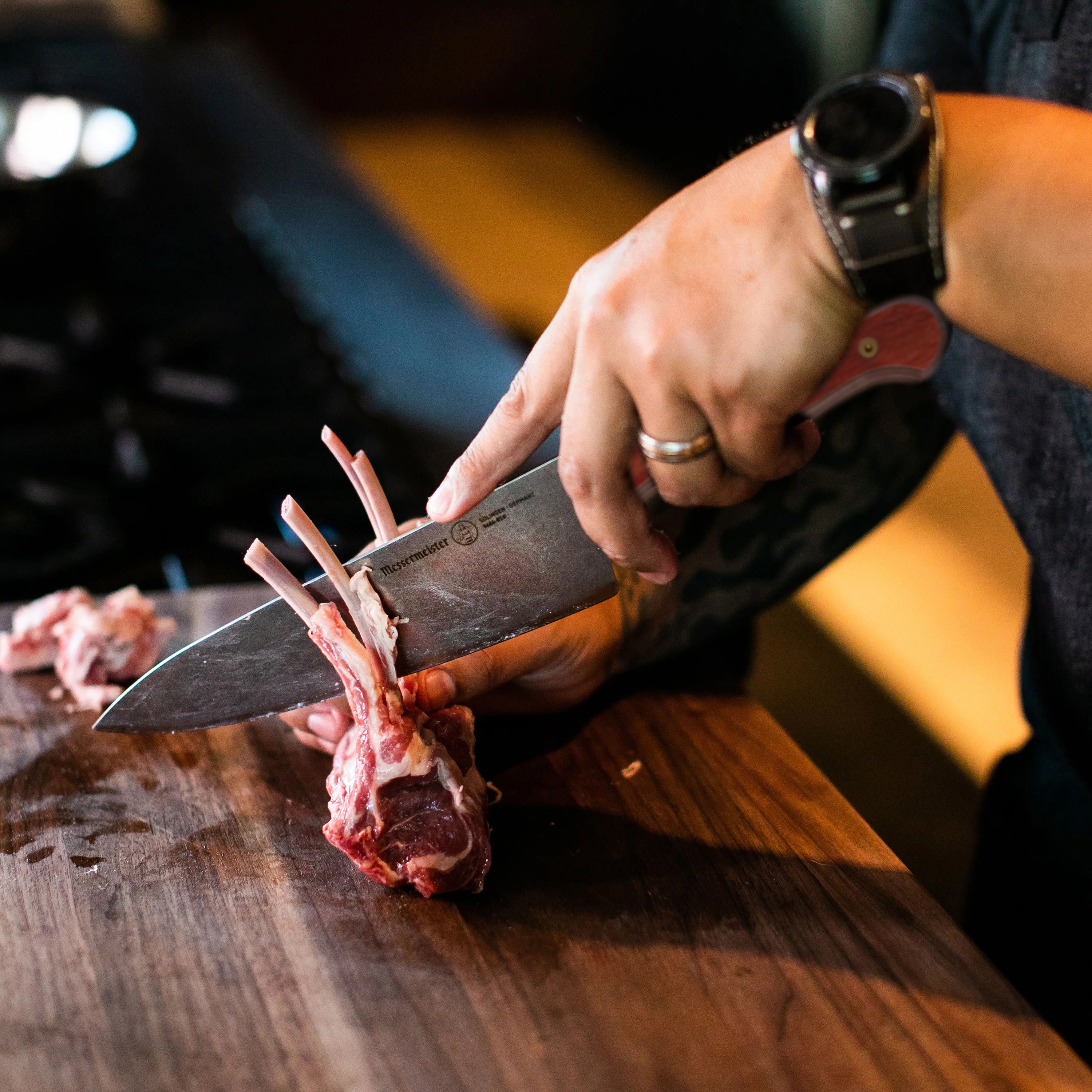 Messermeister ProEdge Terra Red 8-inch chefs knife with detailed blade view