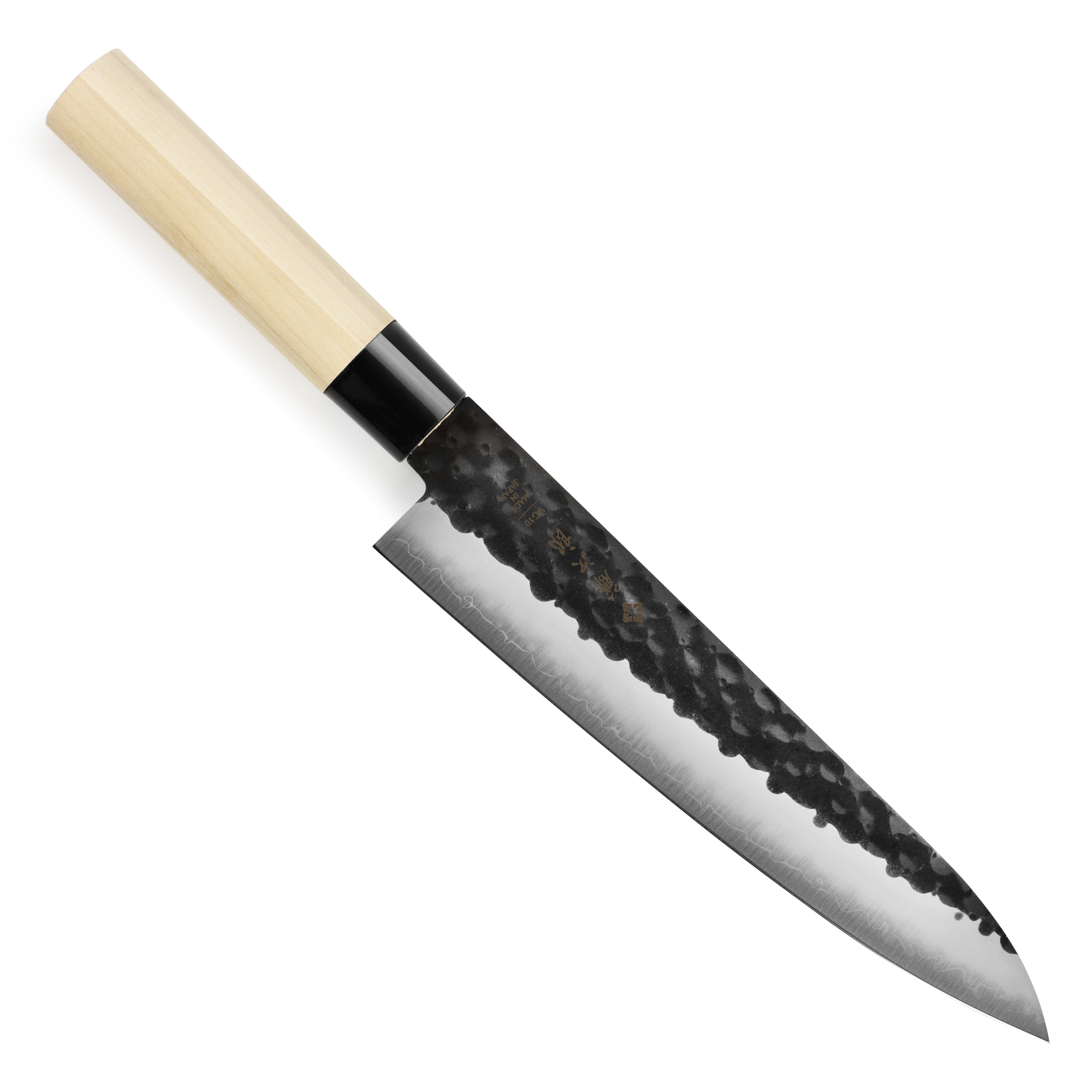 Hammered gyuto chefs knife with kurouchi finish, top view showing the blades craftsmanship