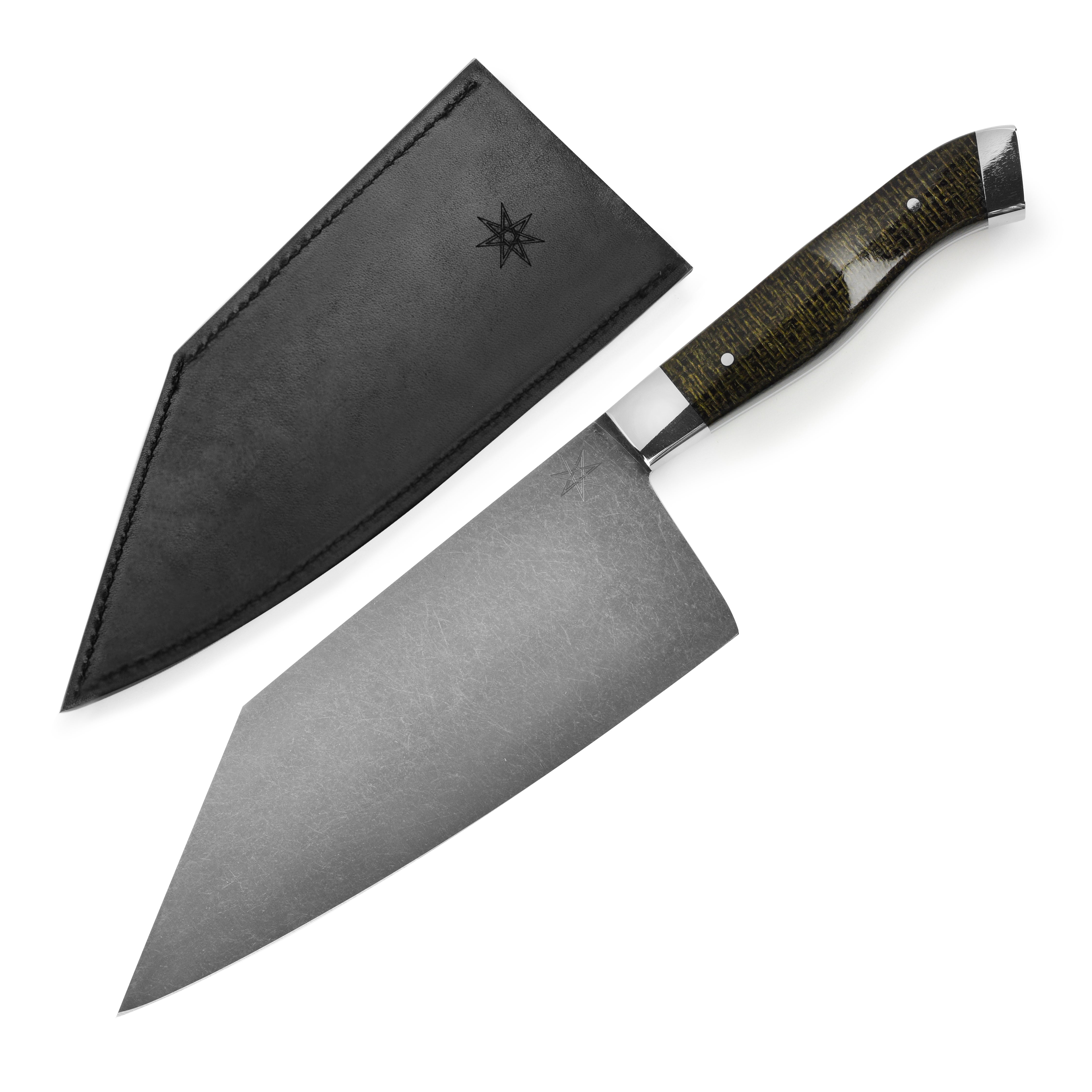 Close-up of the Reno Artisan handmade chef knife showing the carbon steel blade and micarta handle.