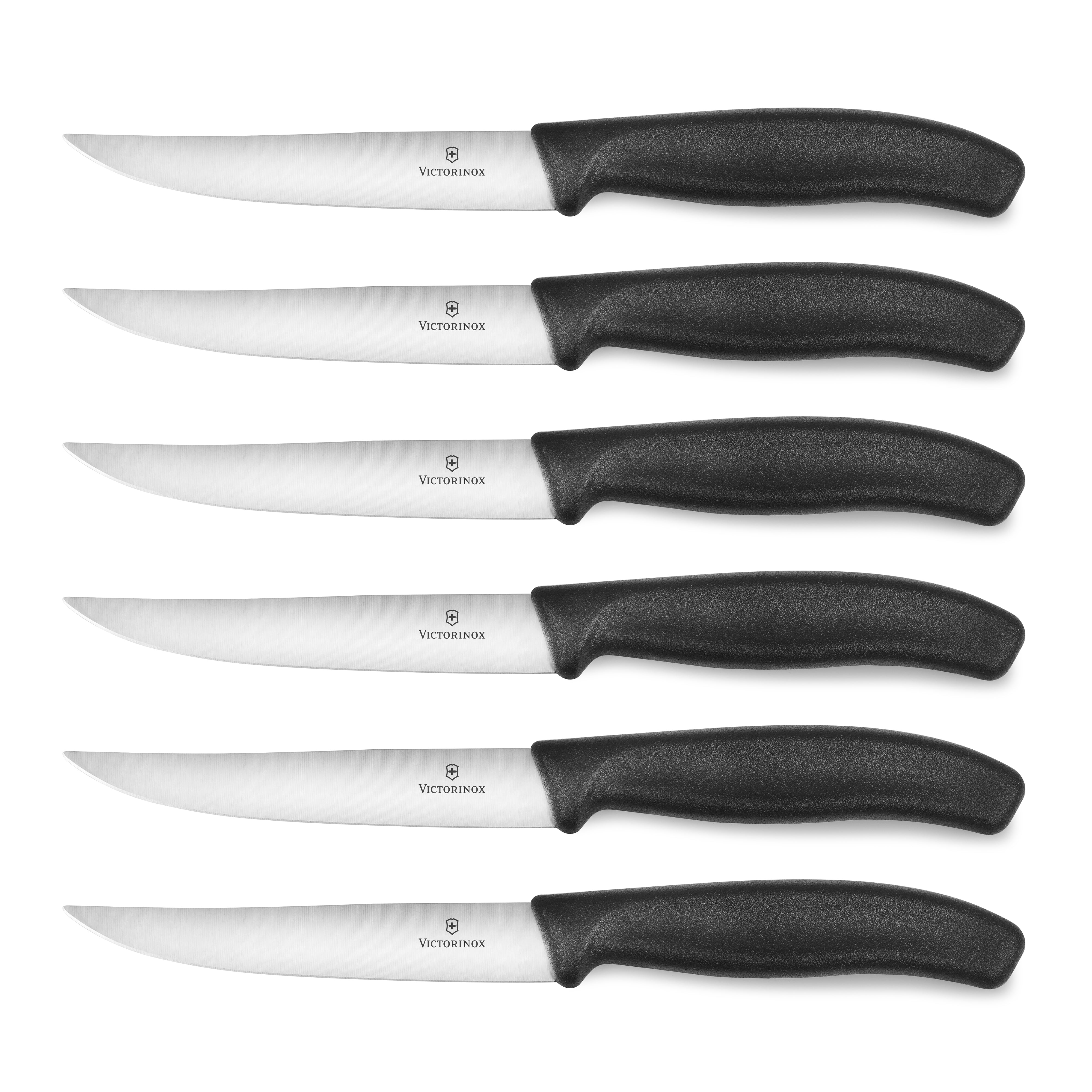 Victorinox steak knife set displayed on a wooden cutting board, showcasing the sleek design and fine edge blades.