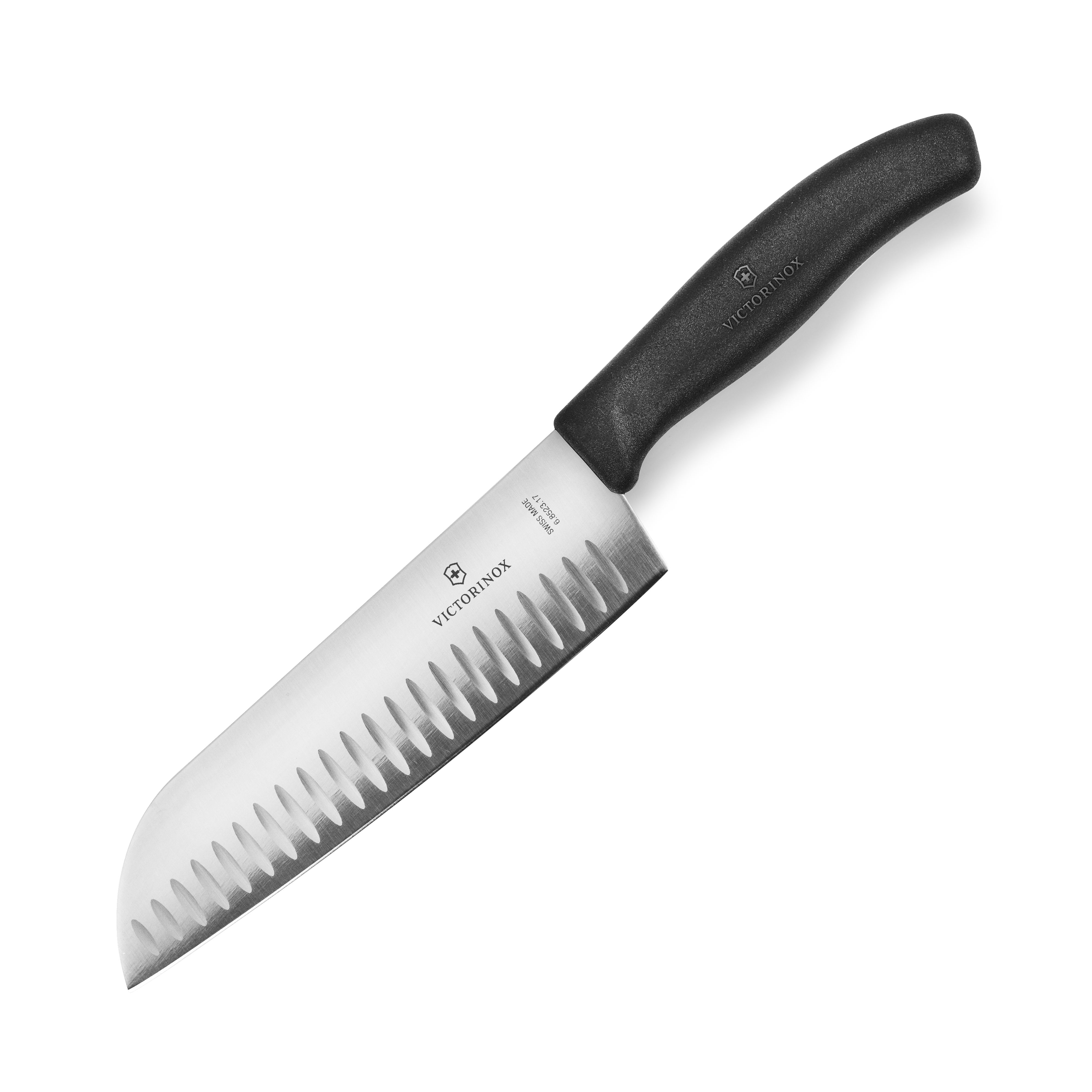 Victorinox Swiss Classic Santoku knife with hollow edge on a cutting board