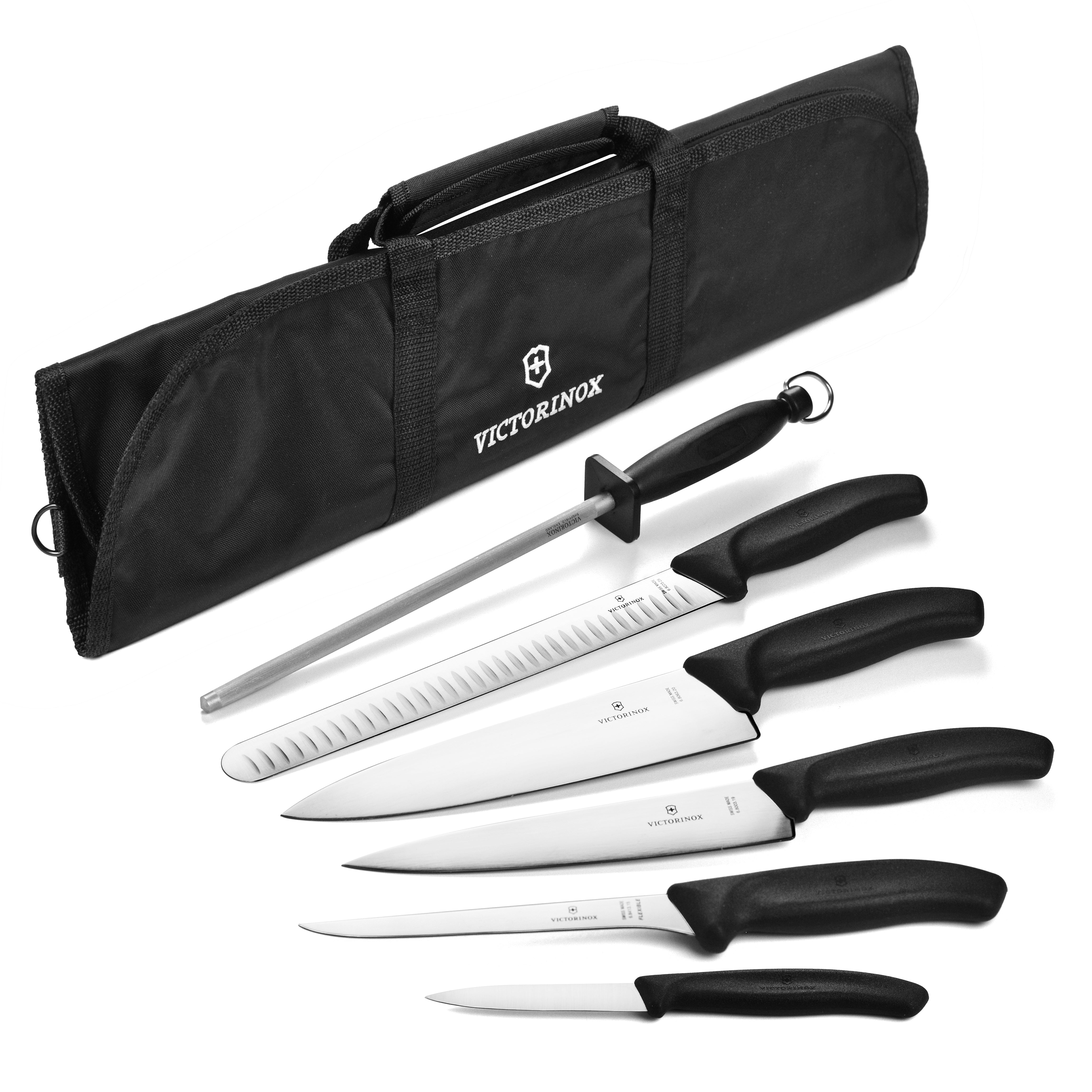 The complete Swiss Precision 7-Piece BBQ Knife Collection displayed on a wooden cutting board.