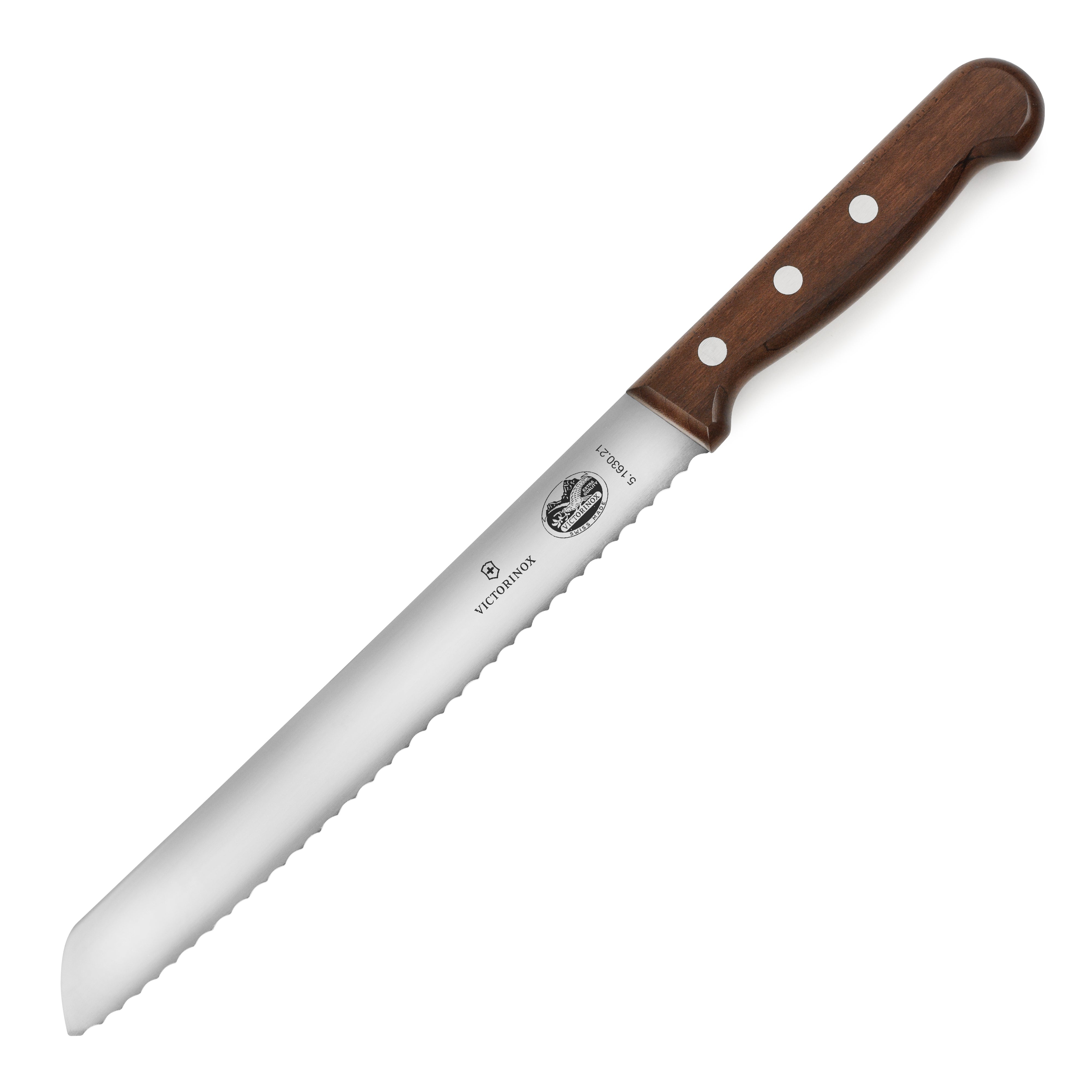 Victorinox bread knife with wooden handle slicing crusty bread on a cutting board