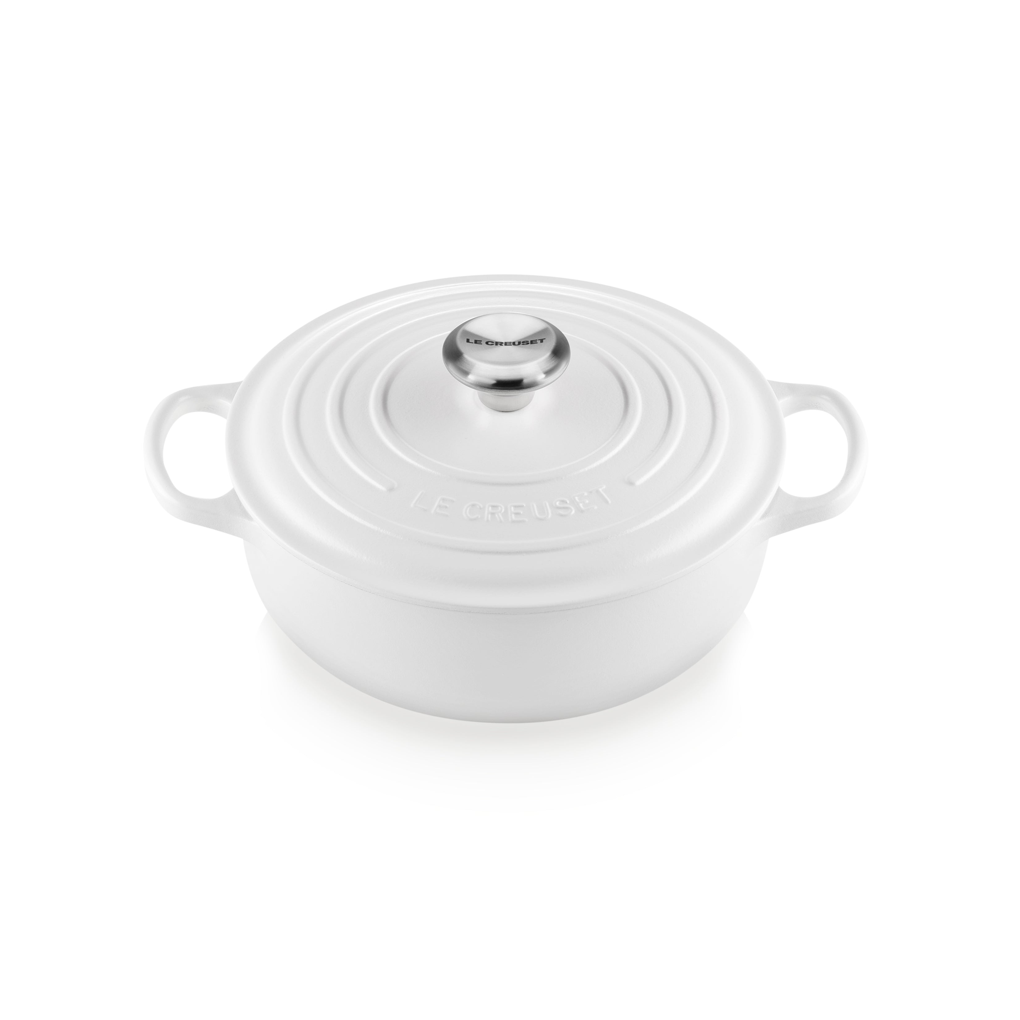 Le Creuset white cast iron Dutch oven with lid and handles, ideal for slow cooking and roasting