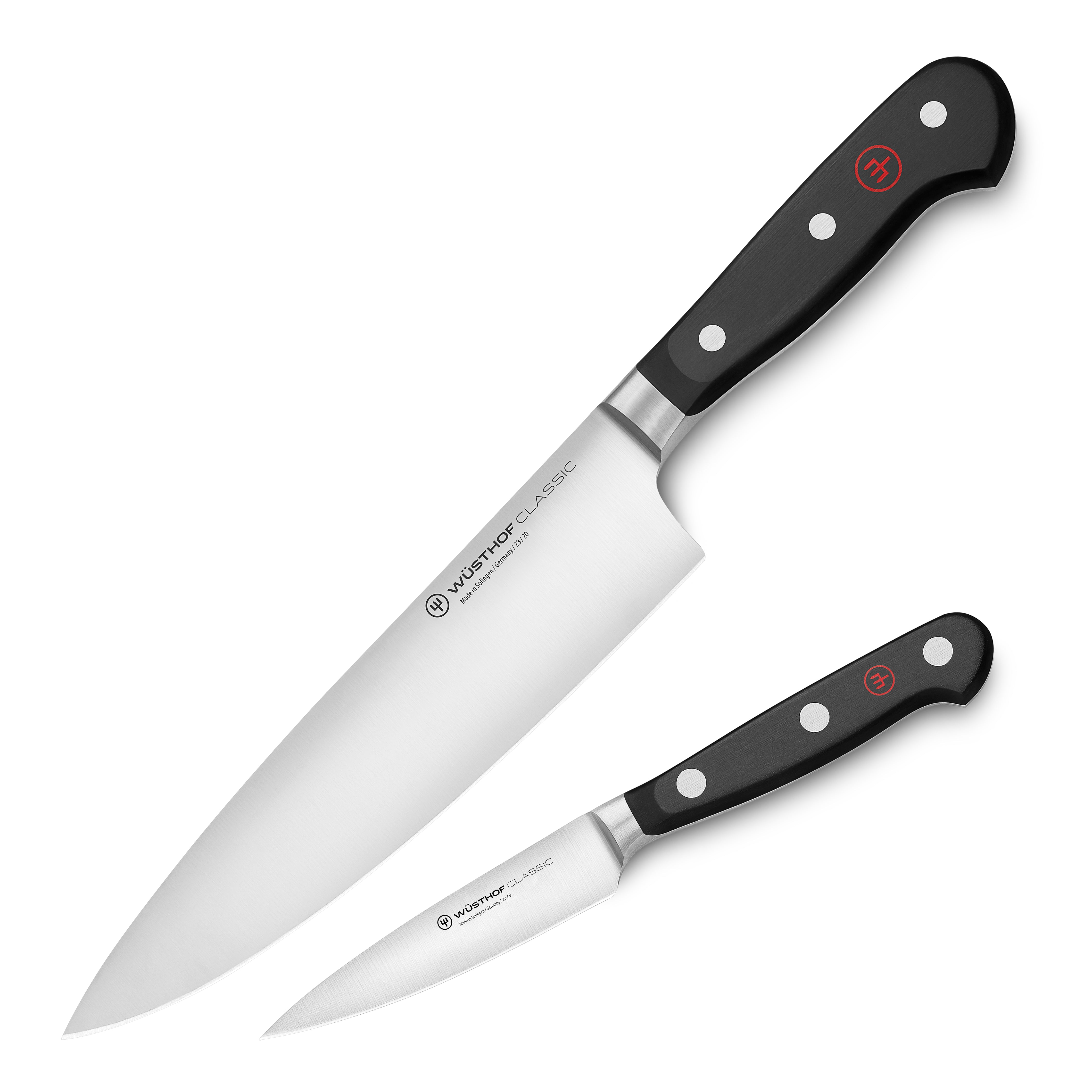 Close-up of Wusthof Classic chef knife with demi bolster, showing sharp blade and ergonomic handle