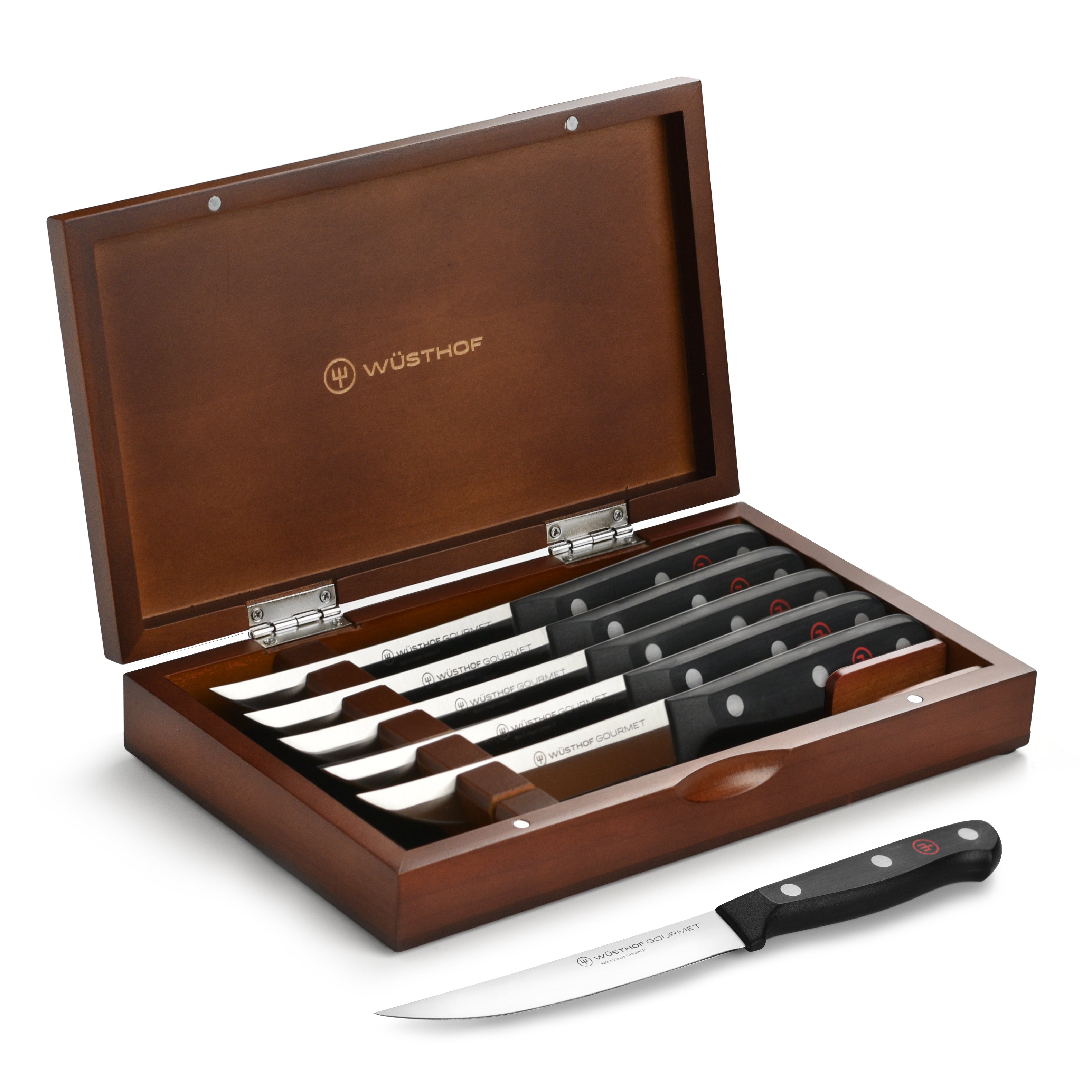 Close-up of Wusthof gourmet steak knives highlighting the precision blade and ergonomic handle.