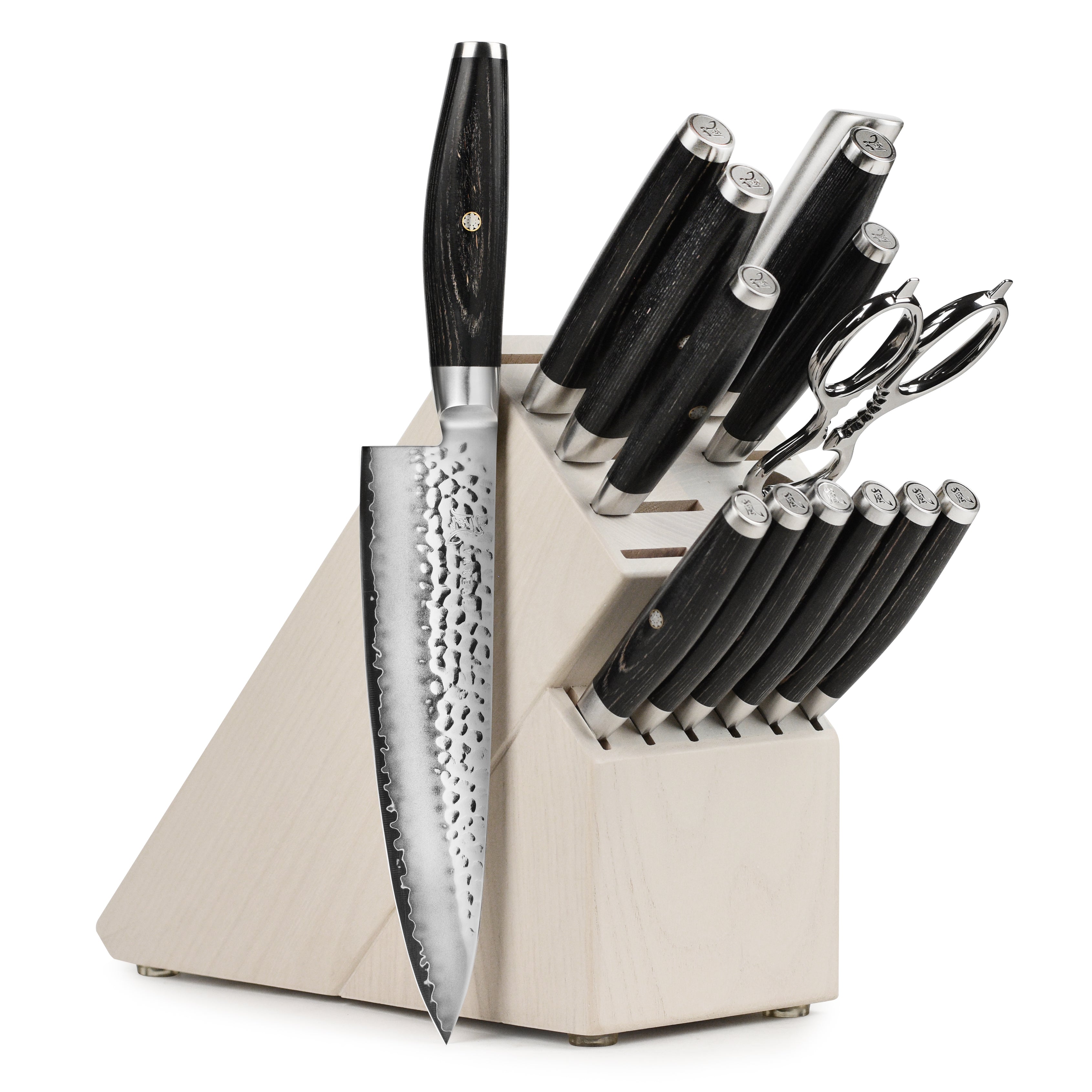 Close-up of hammered Japanese chef knives with black pakkawood handles