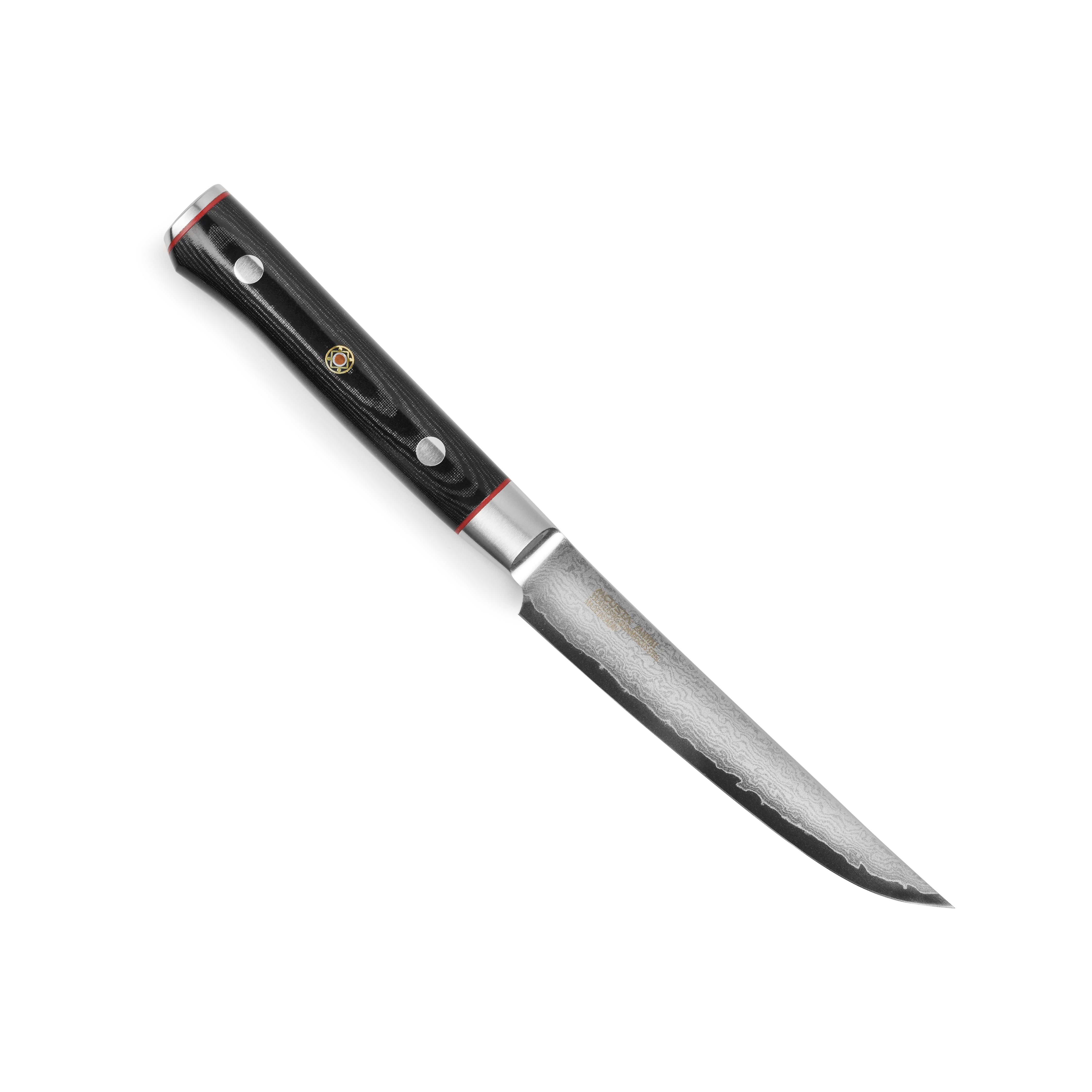 Zanmai Classic Pro Zebra Damascus Steak Knife on a wooden cutting board, highlighting the intricate blade pattern.