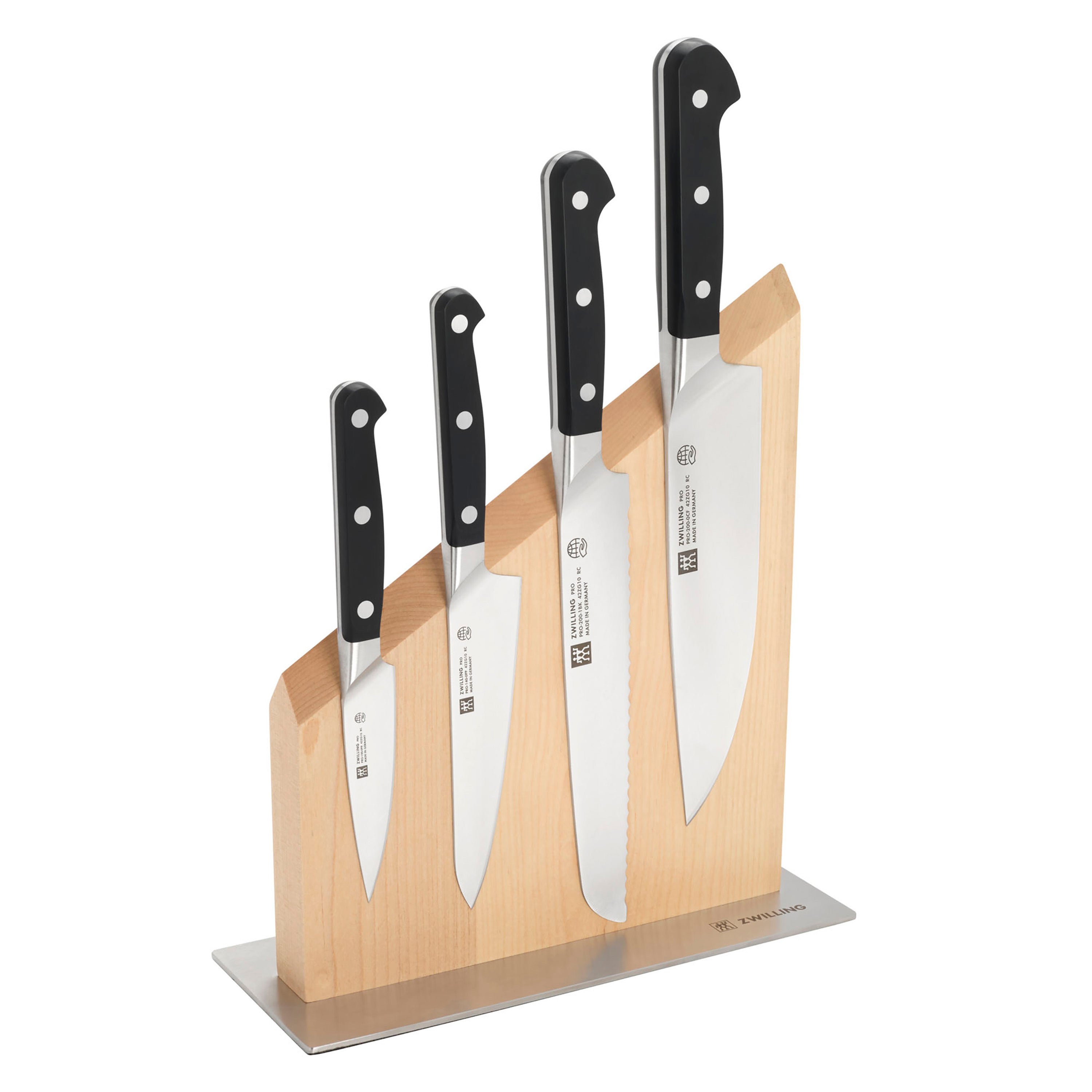 Chef using Zwilling Pro knife for precise slicing on a cutting board