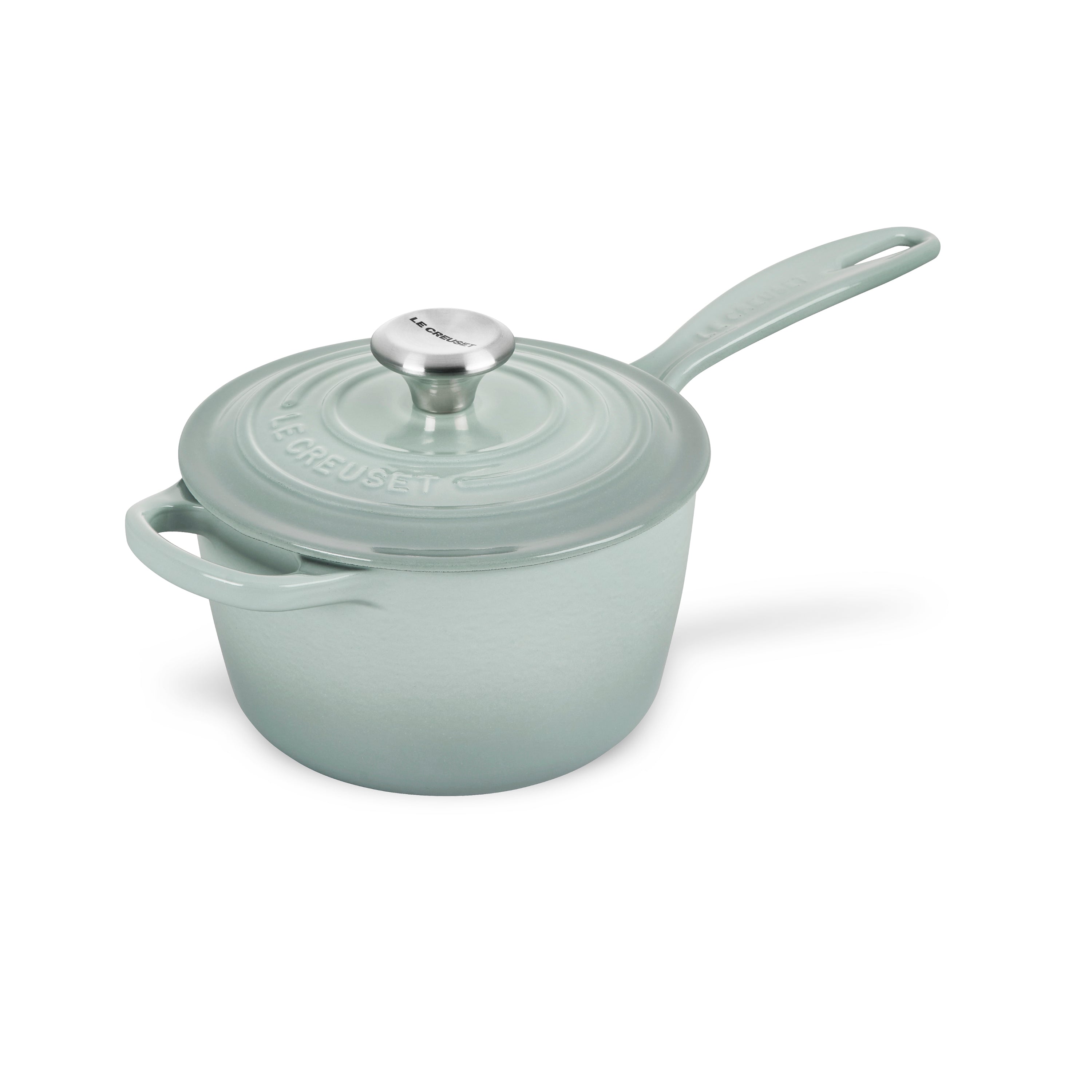 Le Creuset enameled cast iron saucepan from the side, highlighting the ergonomic handle and stainless steel knob.