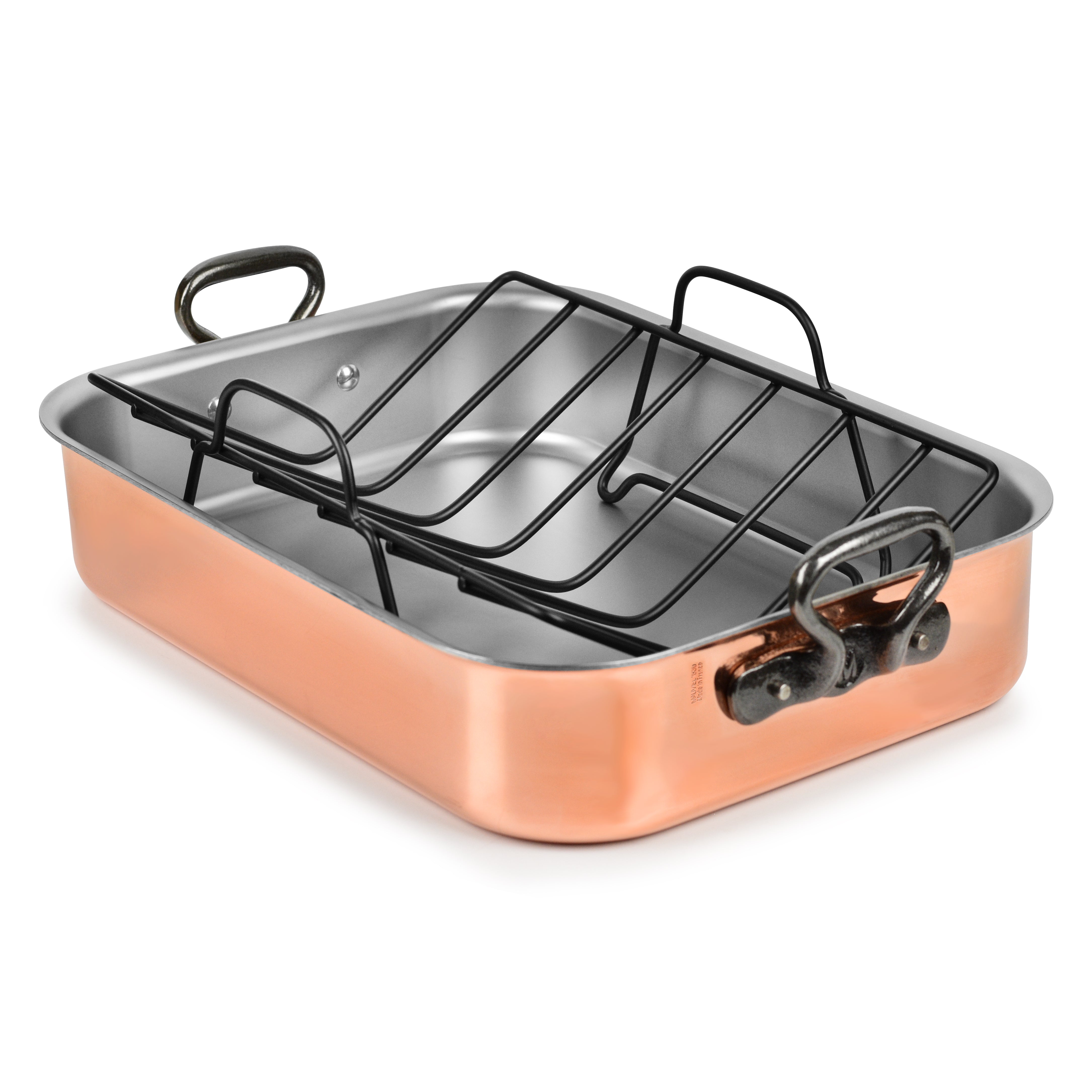 Close-up of Mauviel copper tri-ply roasting pan with cast iron handles and rack