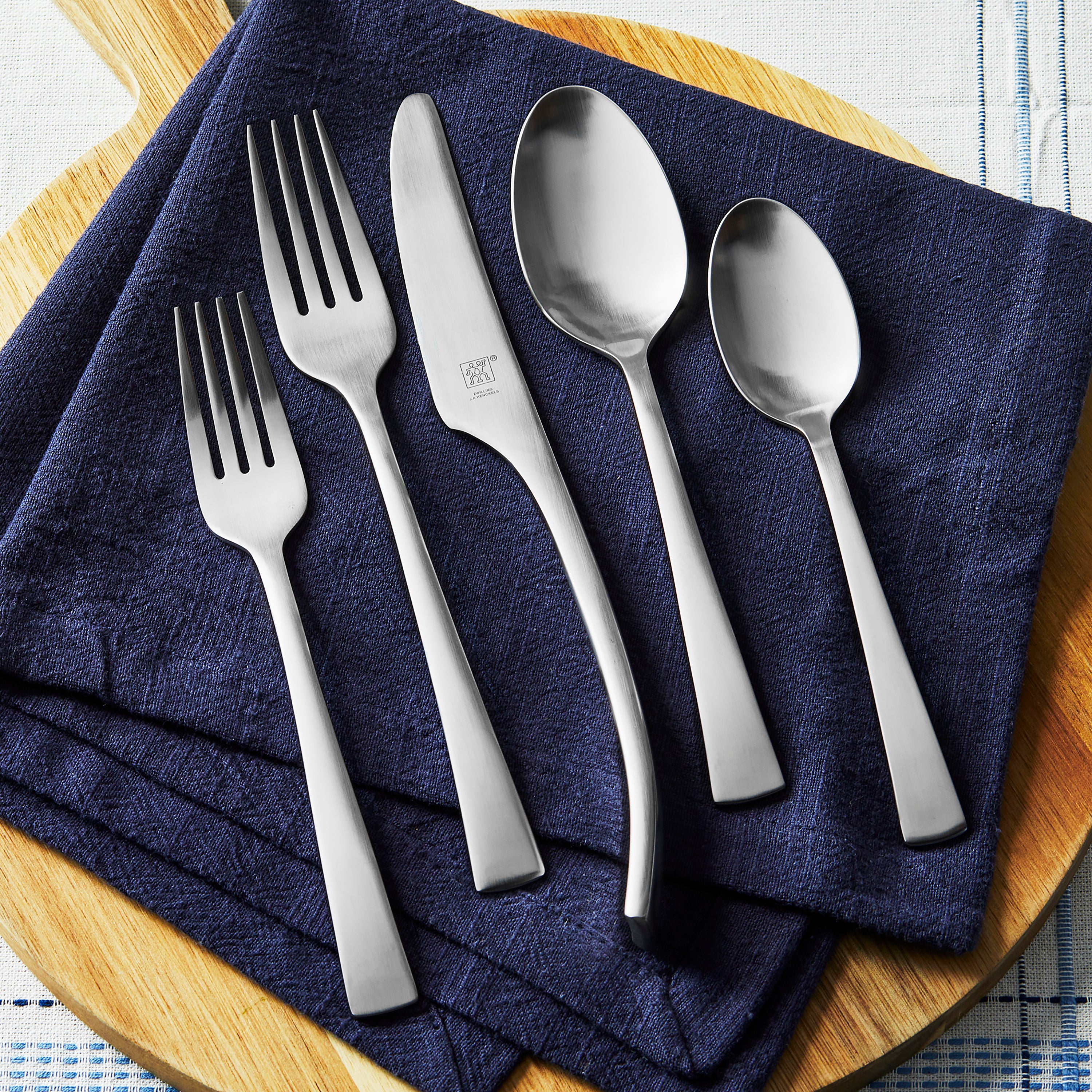 Zwilling Bellasera flatware set elegantly arranged on a dining table.