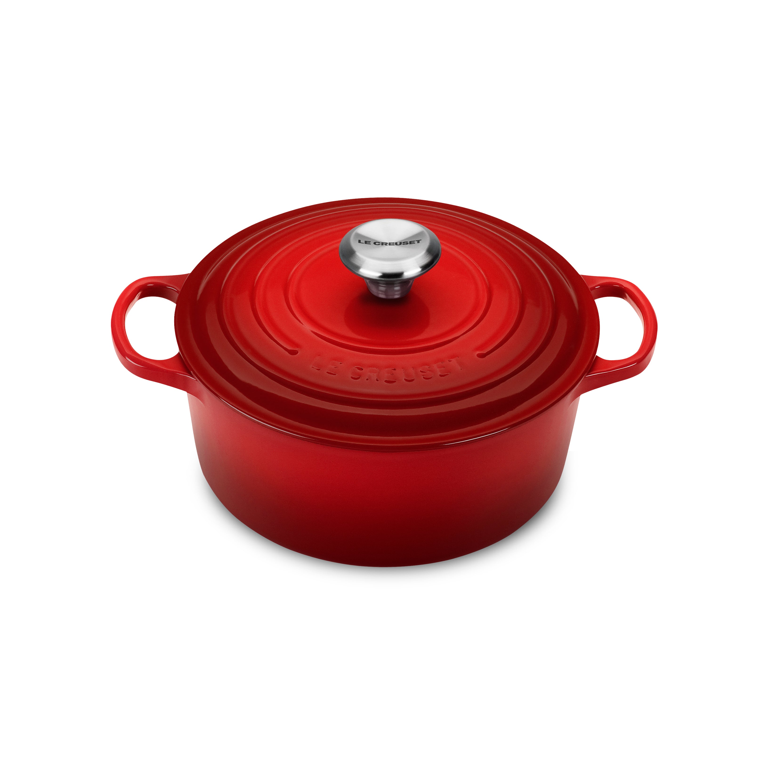 Le Creuset cast iron Dutch oven in Cerise red showcasing its ergonomic handles and enamel finish