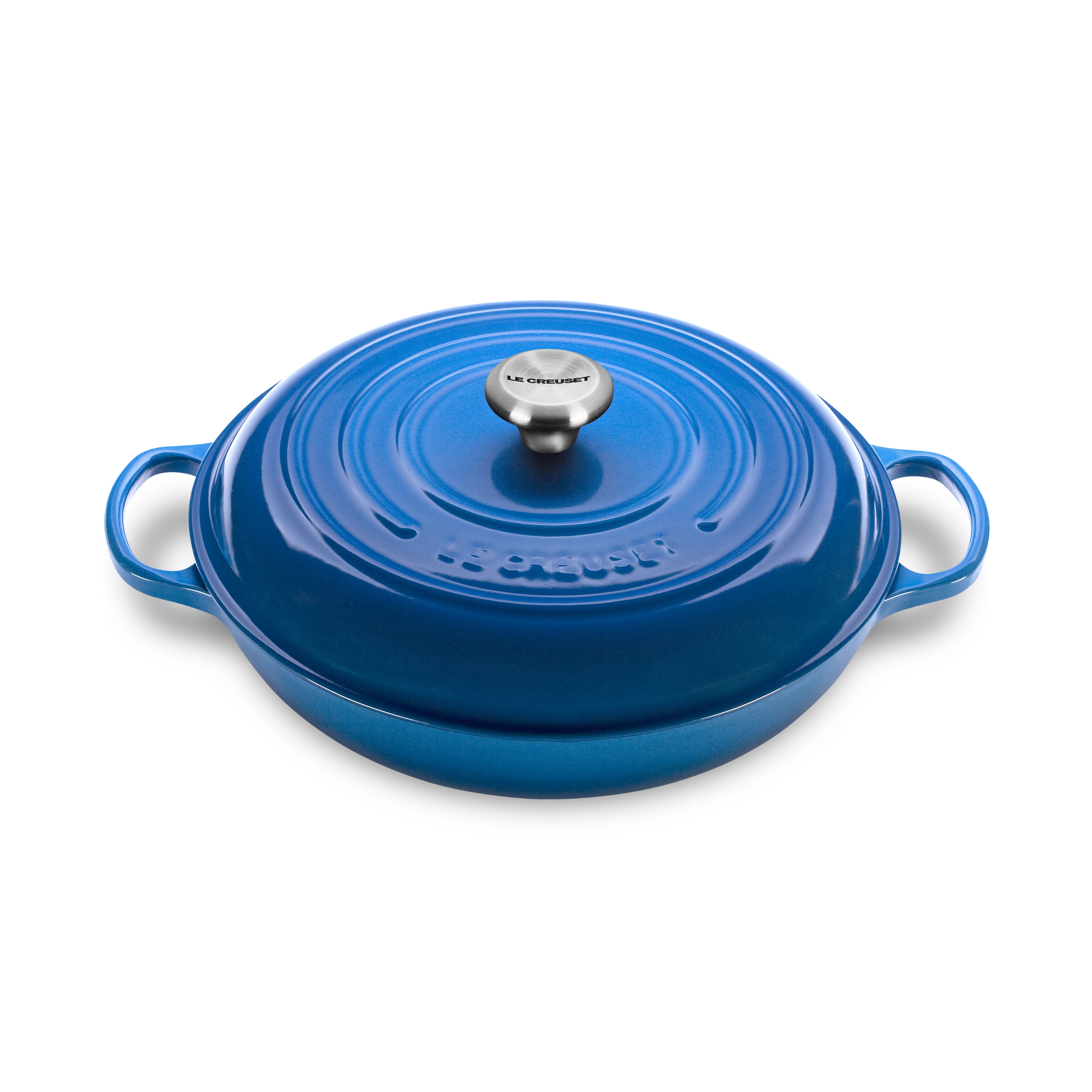 Le Creuset Marseille braiser with lid on stovetop, showcasing its durable enamel finish