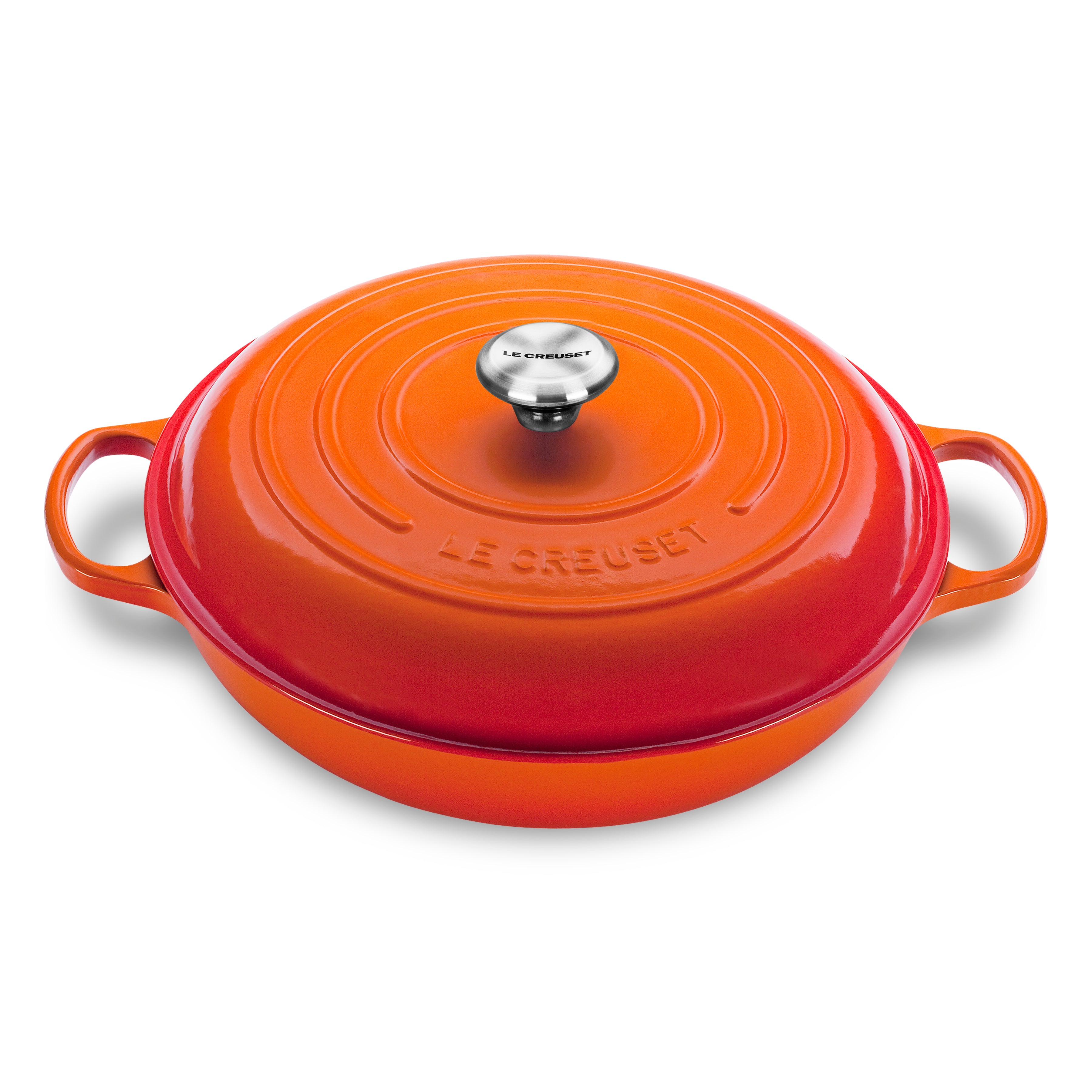 Le Creuset flame enameled cast iron braiser showing ergonomic handles and lid