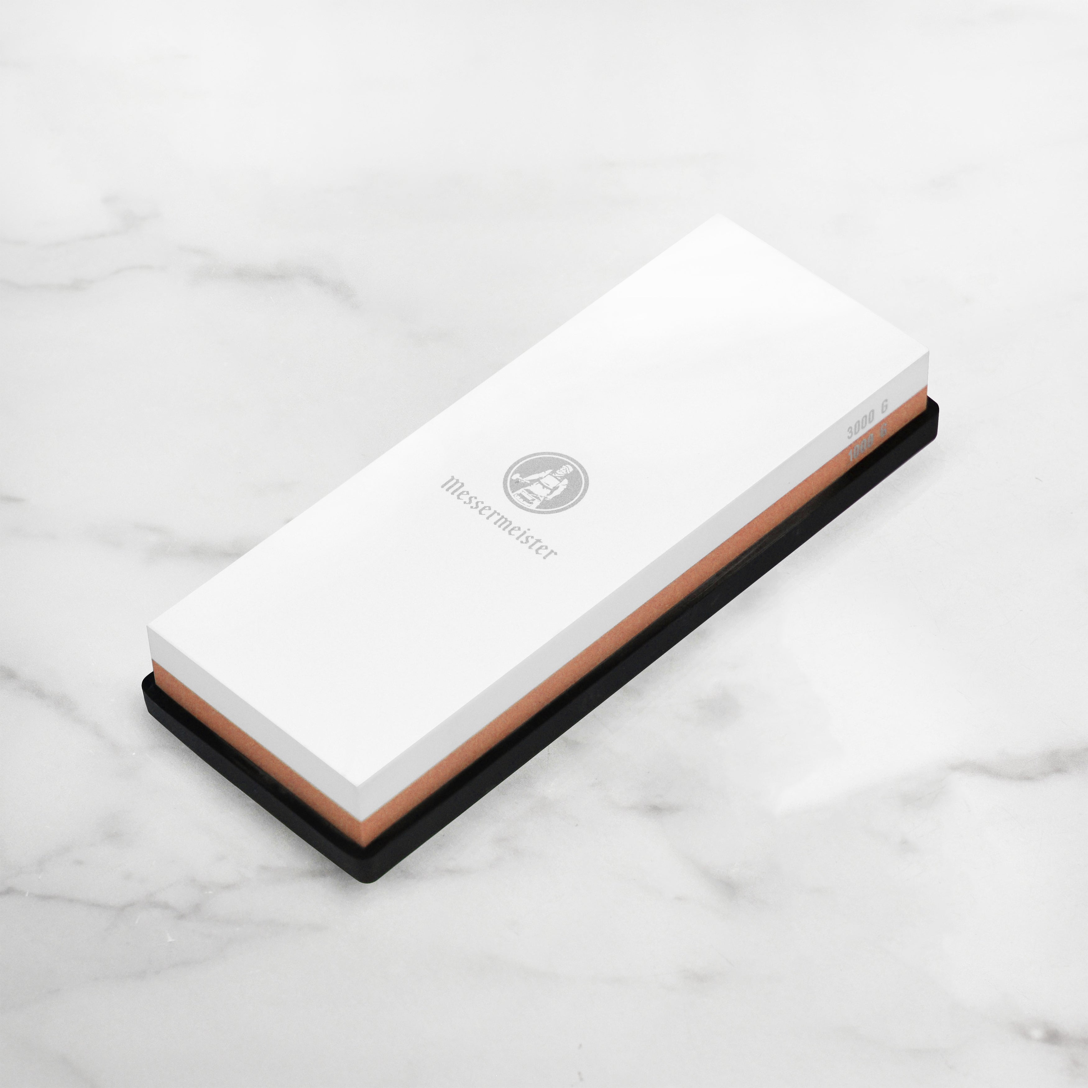Close-up of Precision Edge sharpening stone showing 1000 grit side and 3000 grit side for kitchen knives.