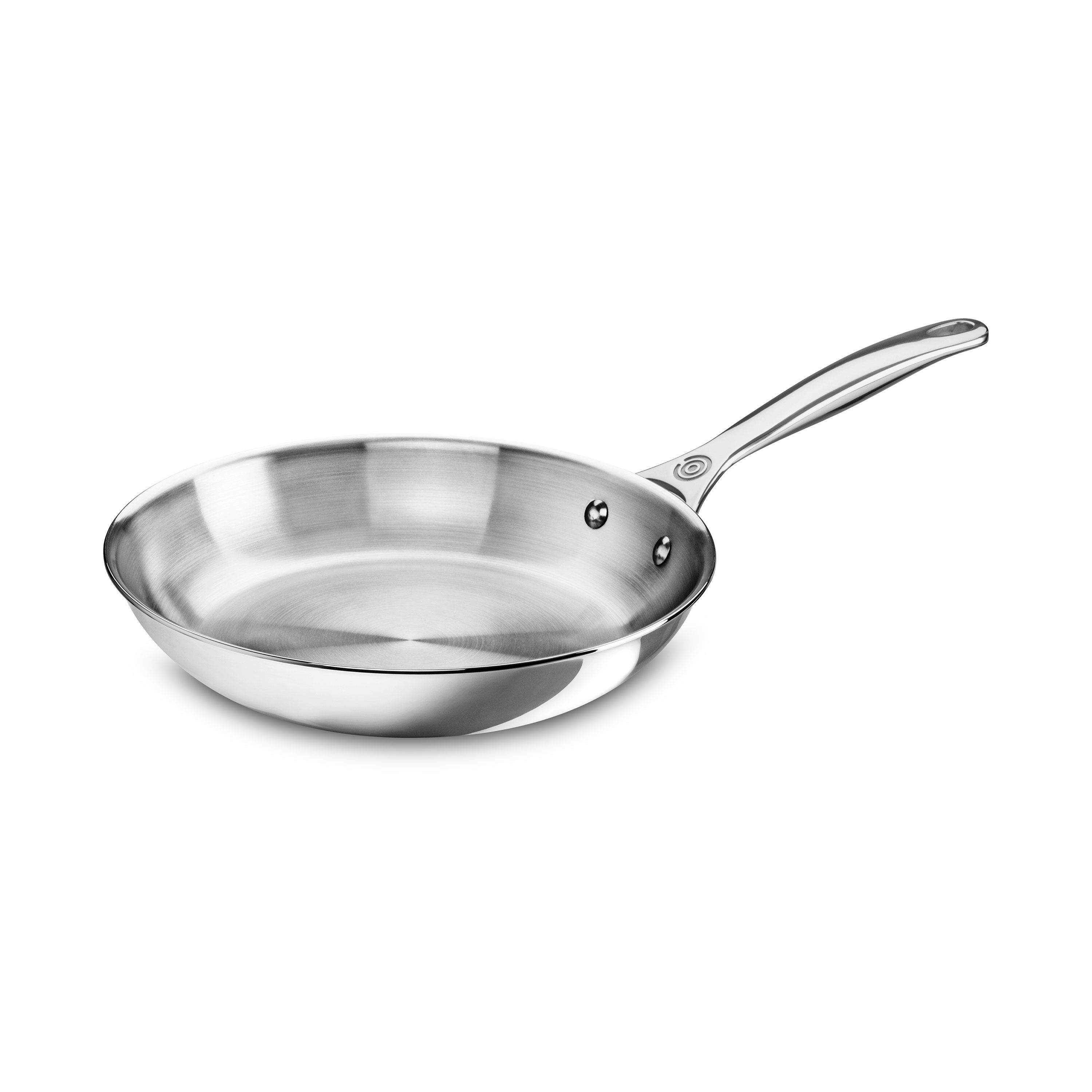 Le Creuset stainless steel skillet viewed from above, highlighting the polished surface and ergonomic handle.
