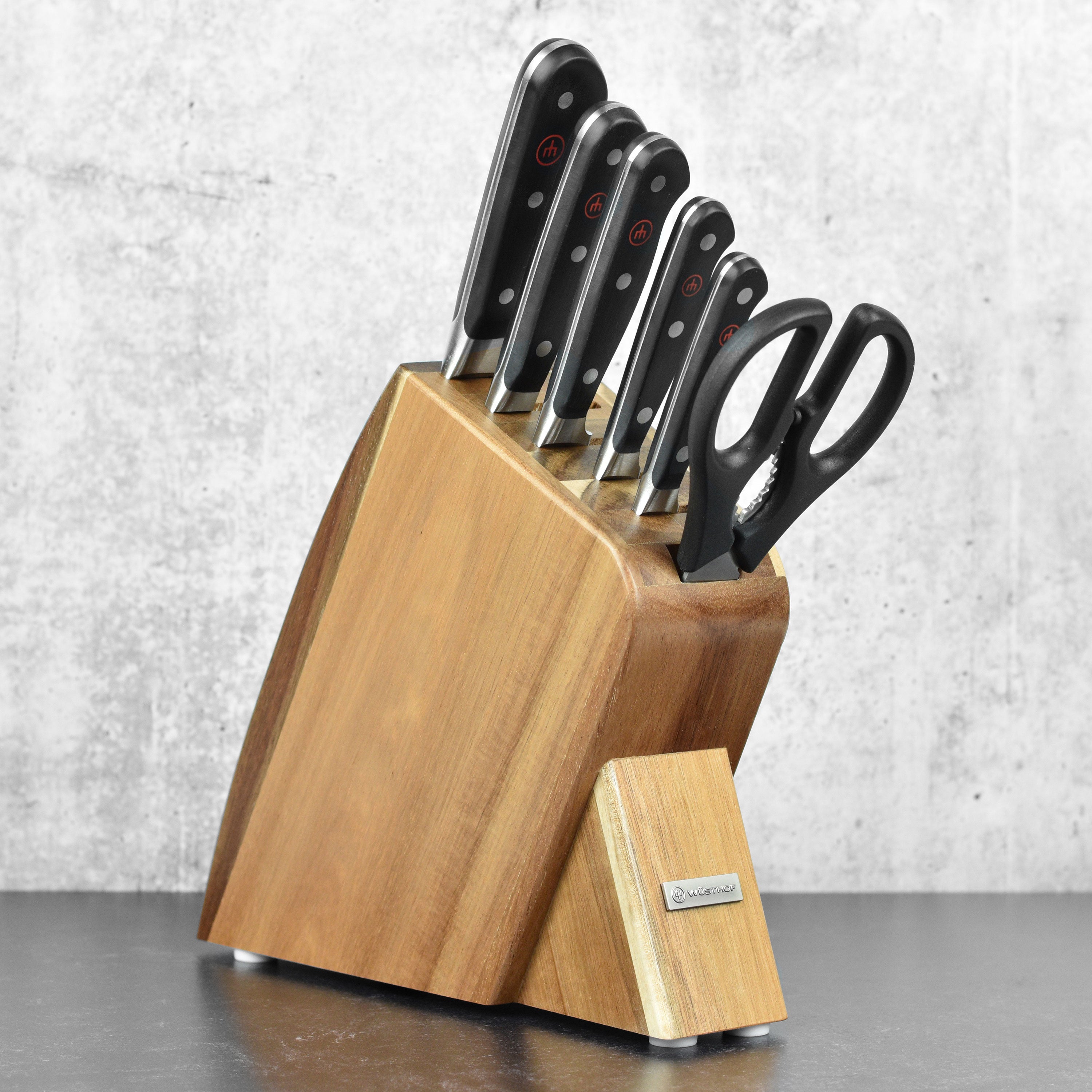 Wusthof Classic knife set displayed in an elegant acacia block, highlighting the craftsmanship and design.