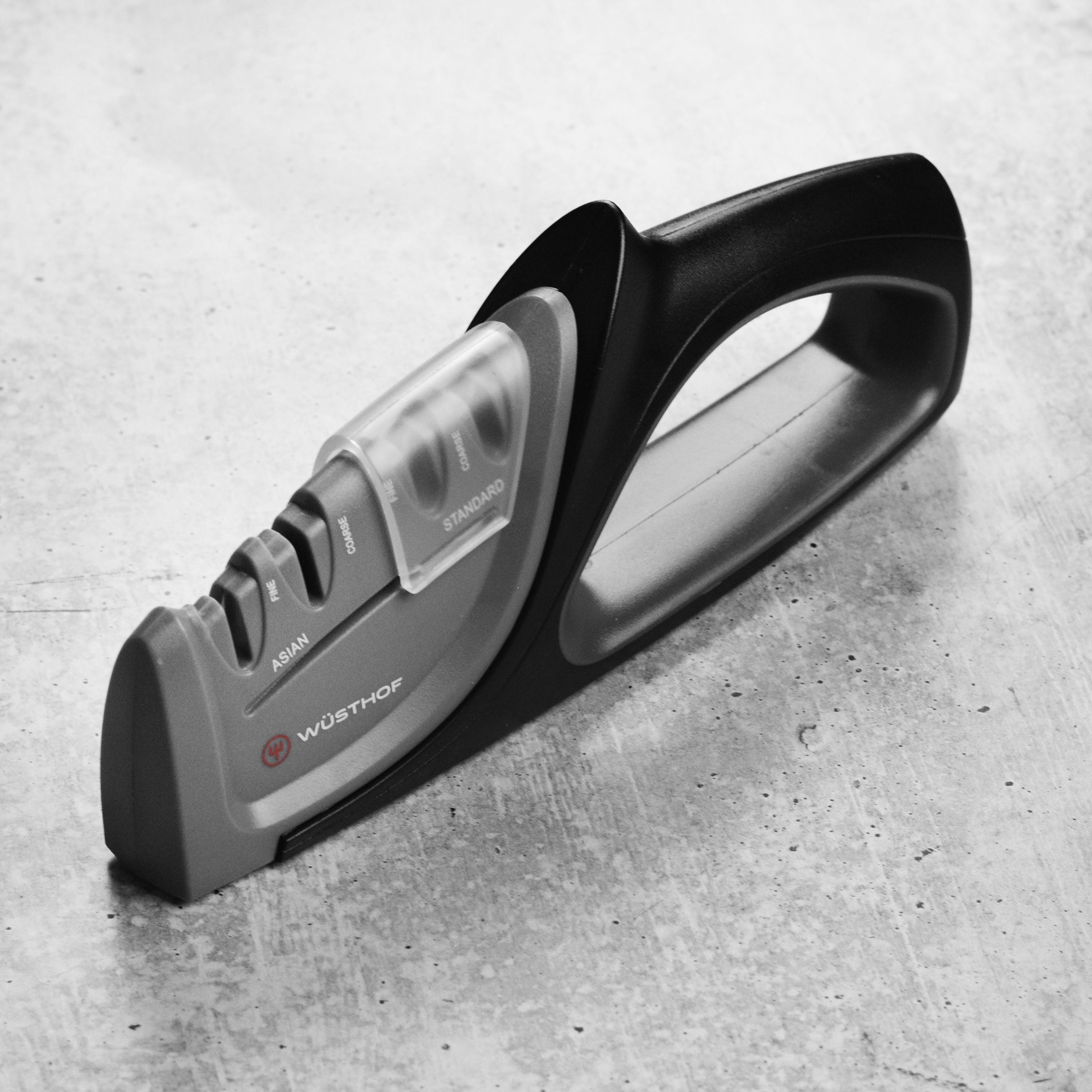 Precision Edge hand-held knife sharpener from the side, showcasing its ergonomic design.