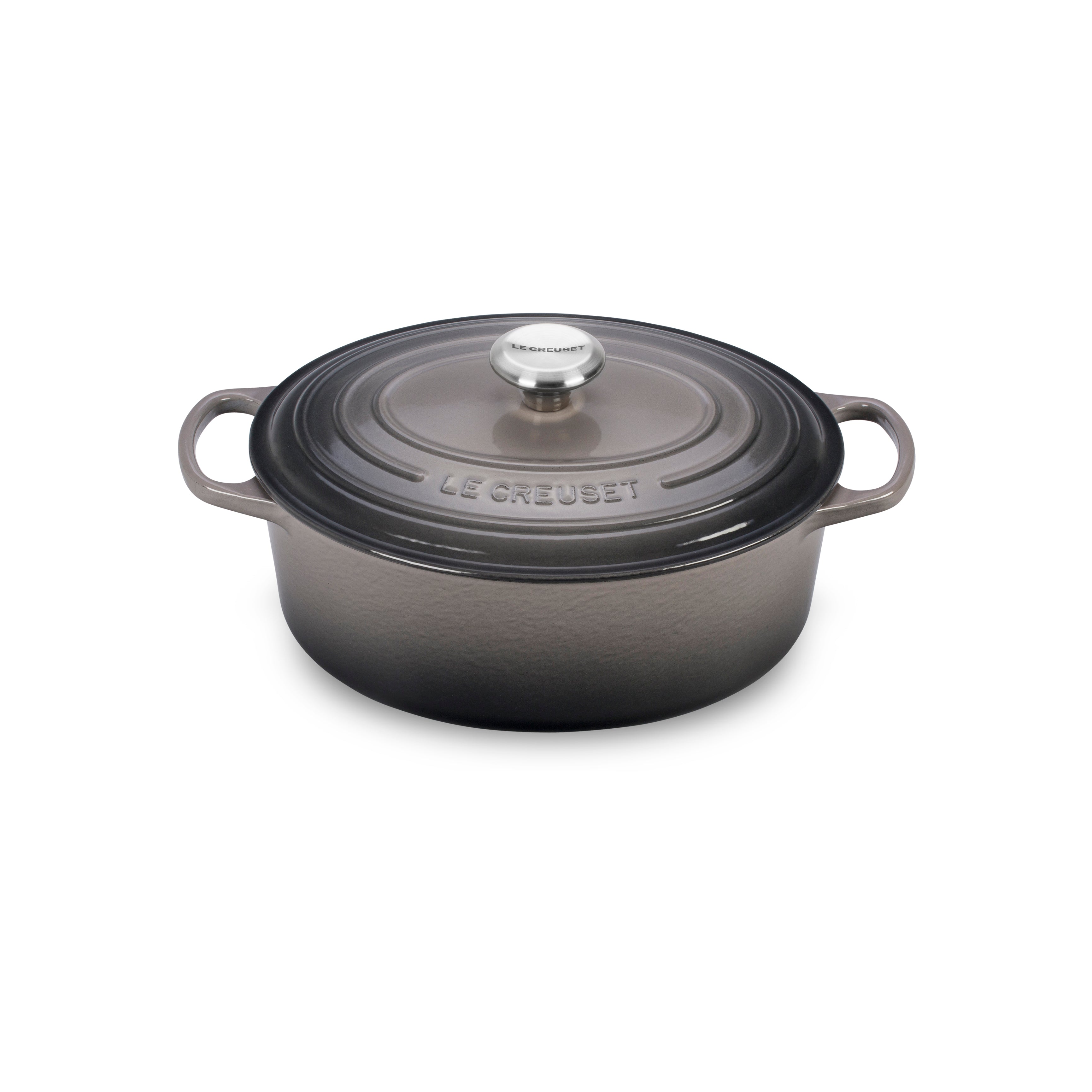 Close-up of the oyster-colored enameled Dutch oven lid with steam circulating