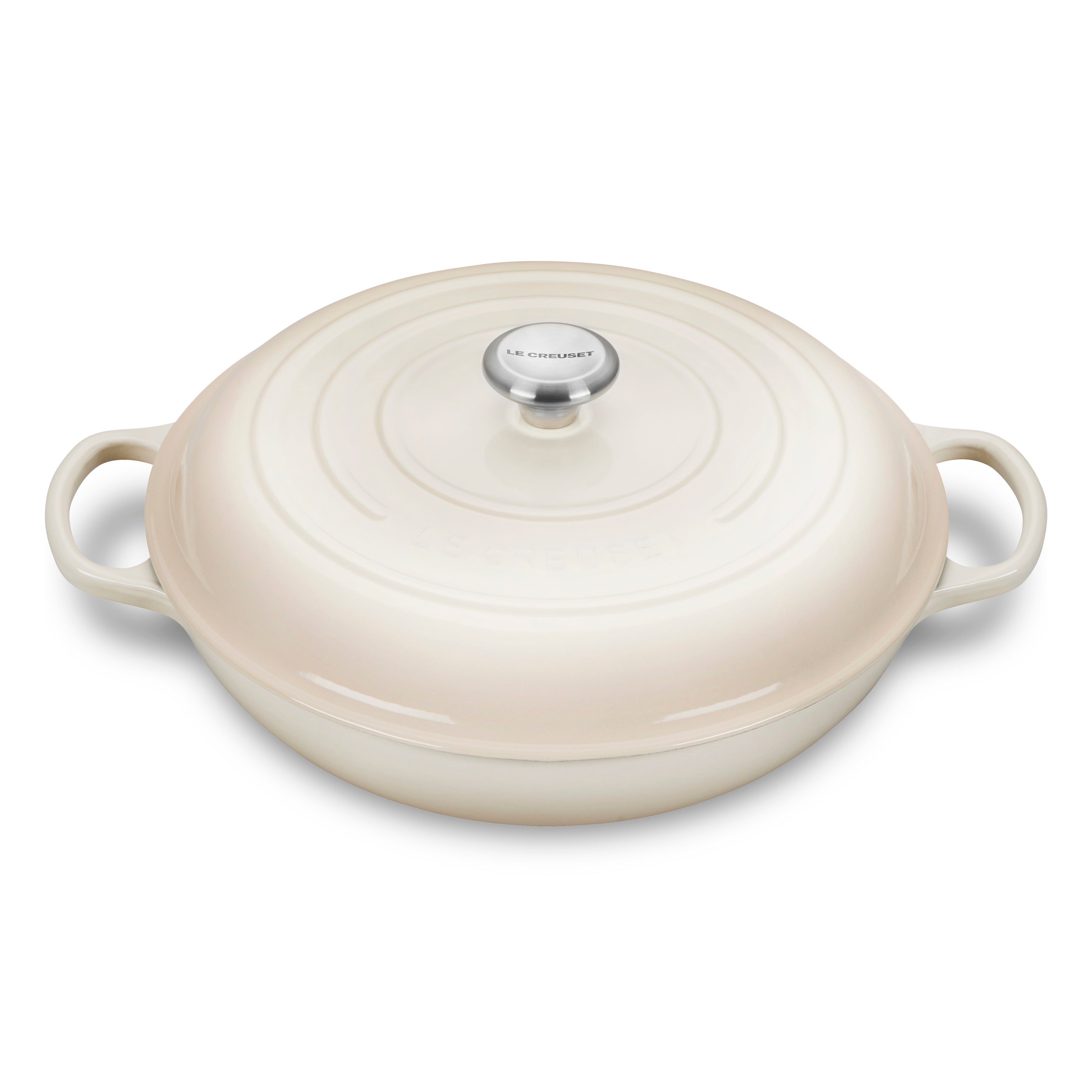 Le Creuset 5-quart enameled cast iron braiser with lid on stovetop, showcasing even heat distribution