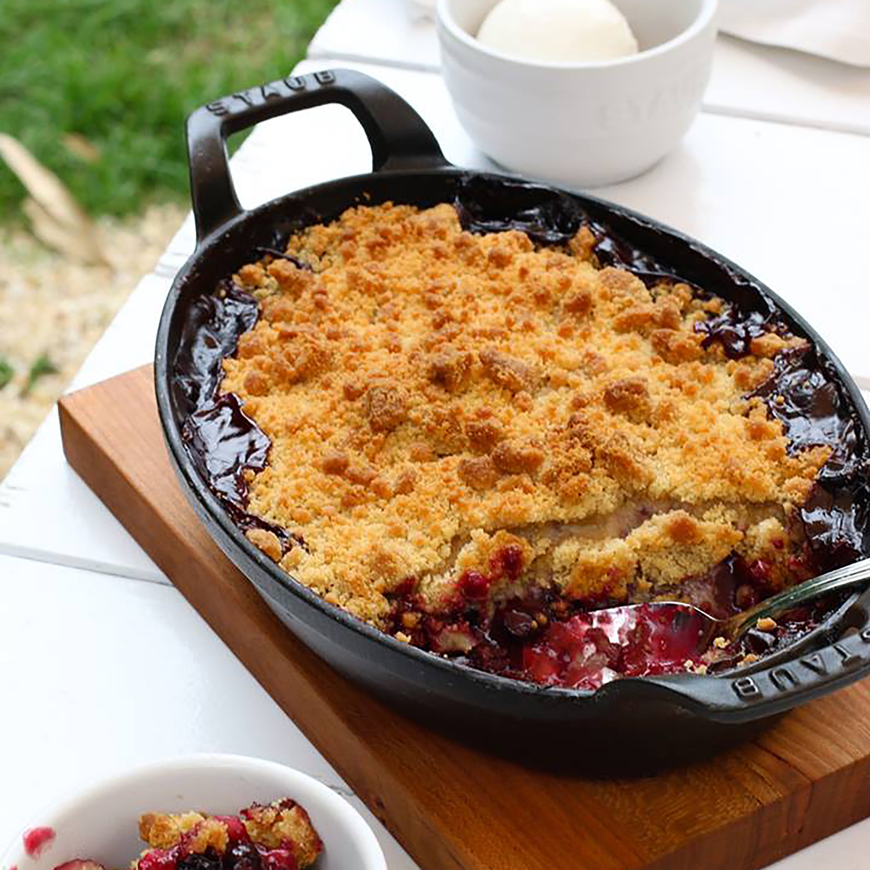 Premium enameled cast iron oval au gratin dish from a top angle, showcasing its matte black finish.