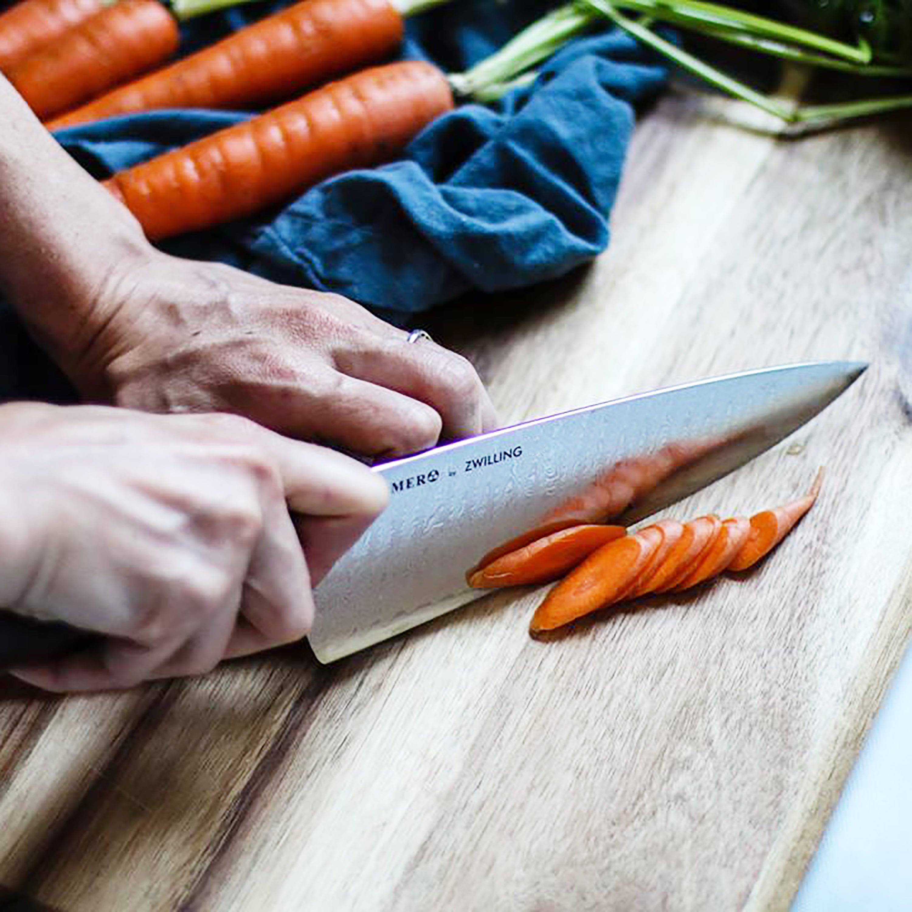 Premium magnetic knife block for kitchen with Kramer Meiji knives displayed at an angle