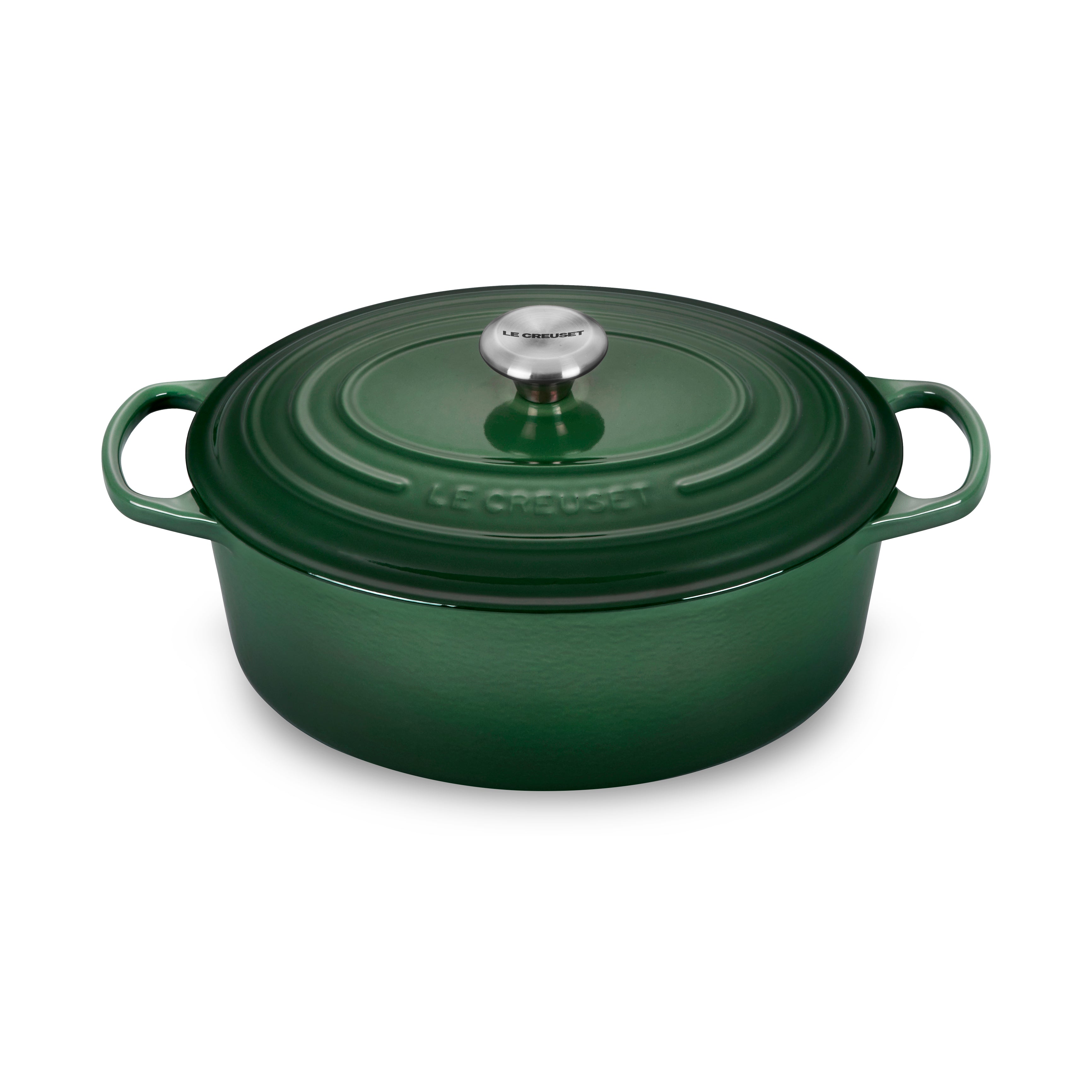 Le Creuset enameled Dutch oven with lid on stovetop for slow cooking