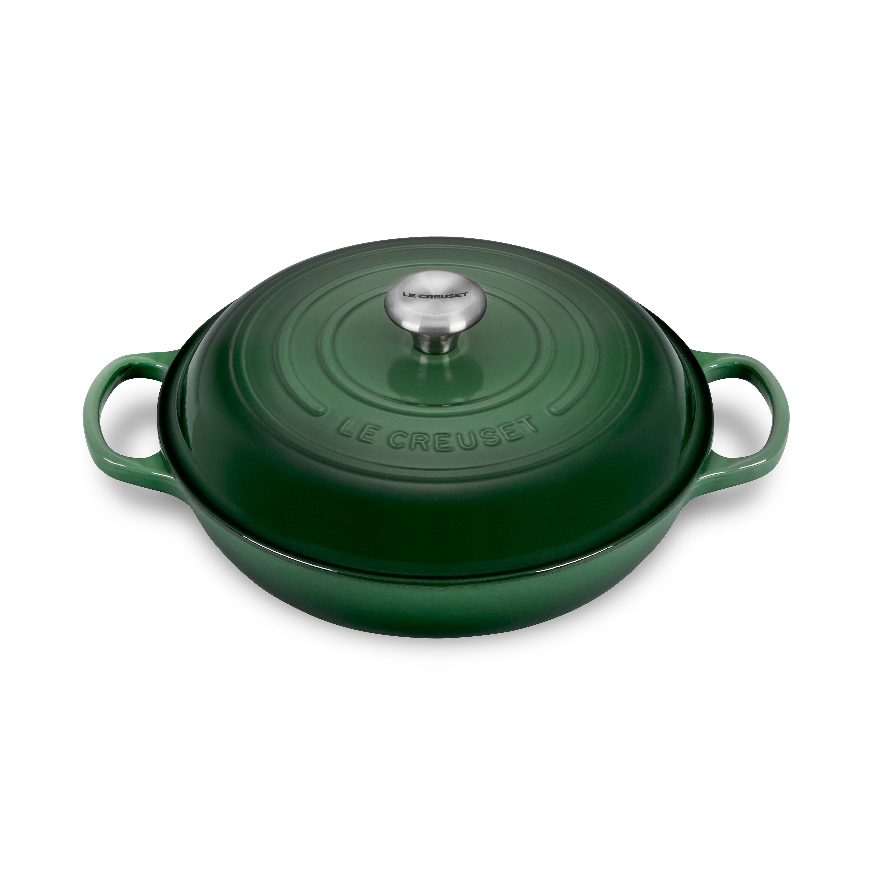 Le Creuset braiser with lid showcasing the vibrant artichaut color and ergonomic handles.