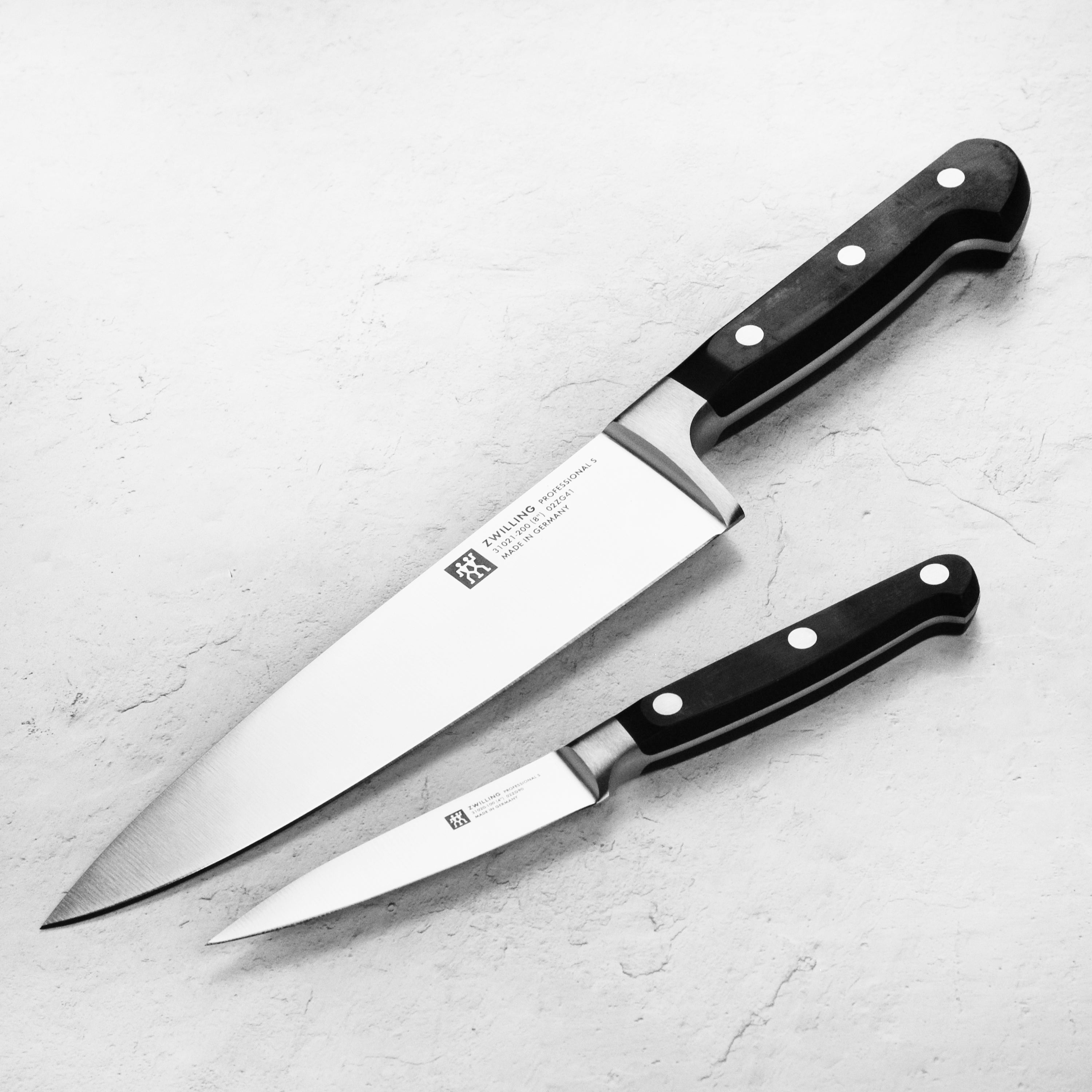 Chef knife from Zwilling Professional S set showcasing its sharp blade and ergonomic handle.
