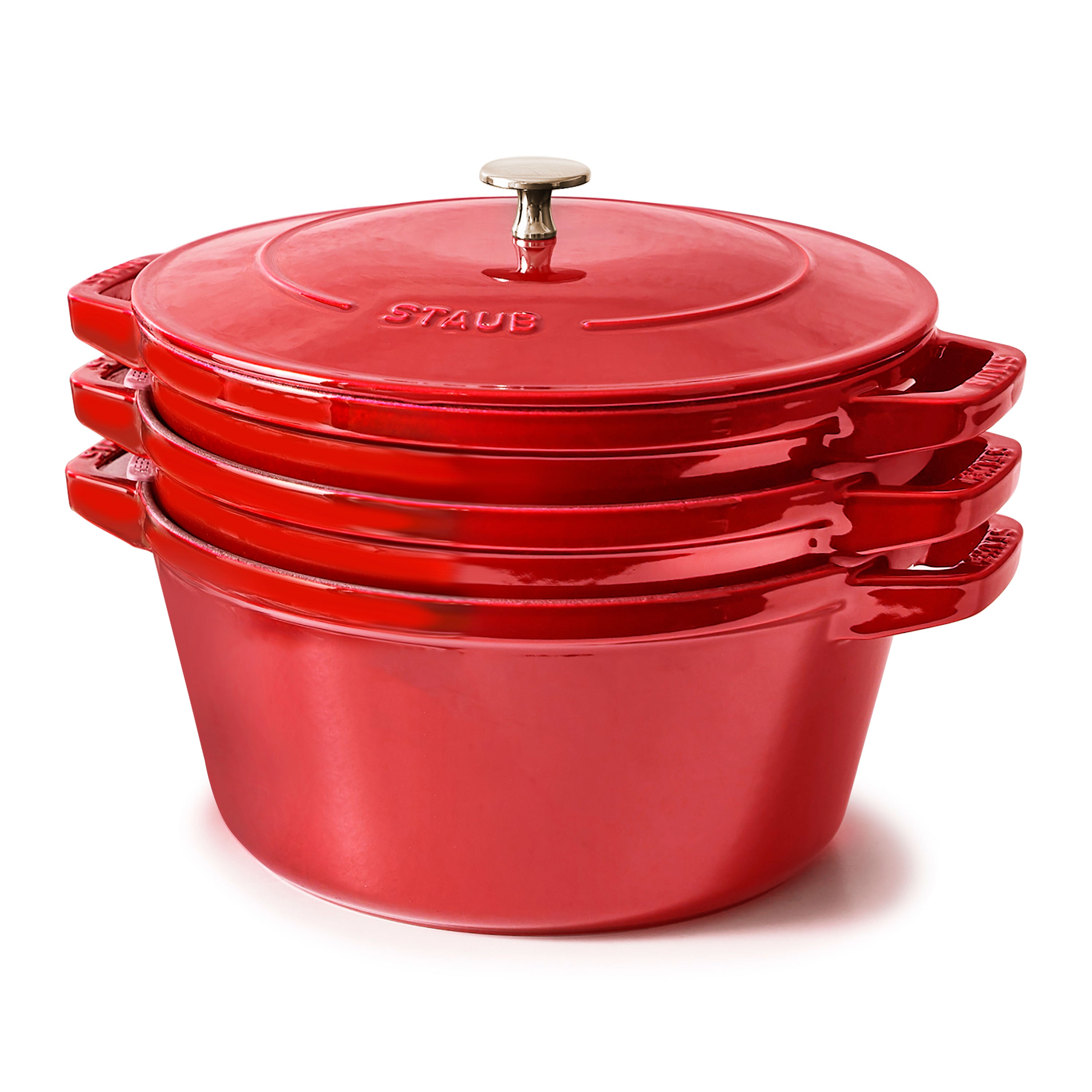 Cherry Red Stackable Cast Iron Cooking Set displayed in a kitchen setting, highlighting its vibrant color and design.